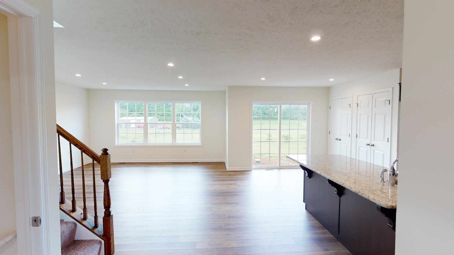 Main level living area - family room, and kitchen - vinyl plank flooring