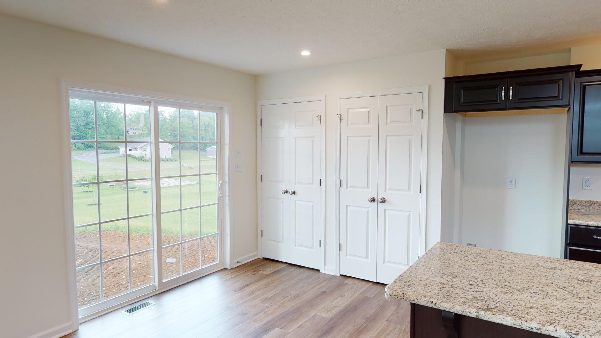 Breakfast area with sliding glass door and double pantry
