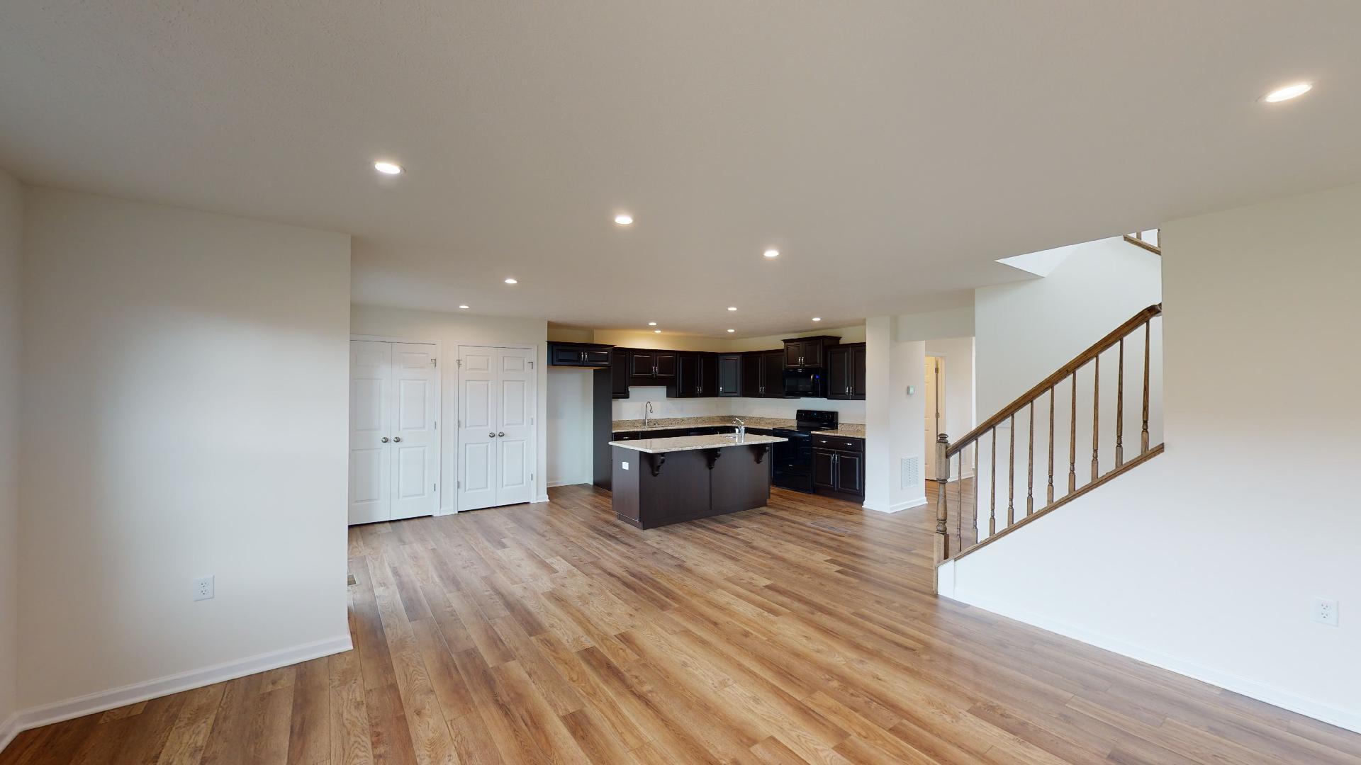 Facing the kitchen area from the family room - vinyl plank flooring
