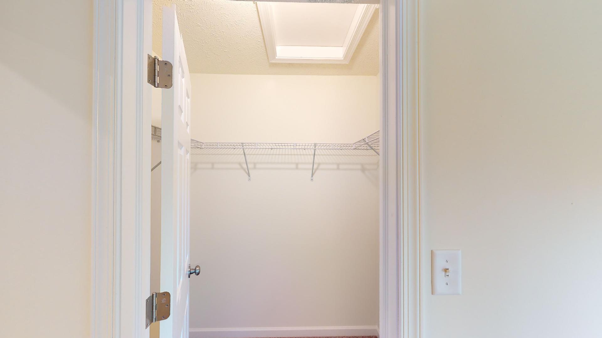 Owner's bedroom closet with wire shelving