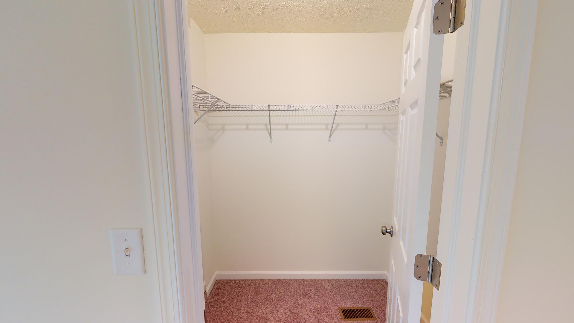 Owner's bedroom closet with wire shelving
