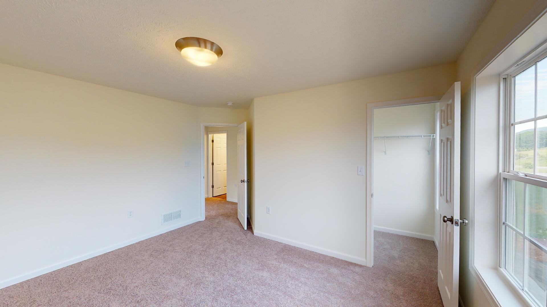 Bedroom 2 - facing doorways to hall and closet