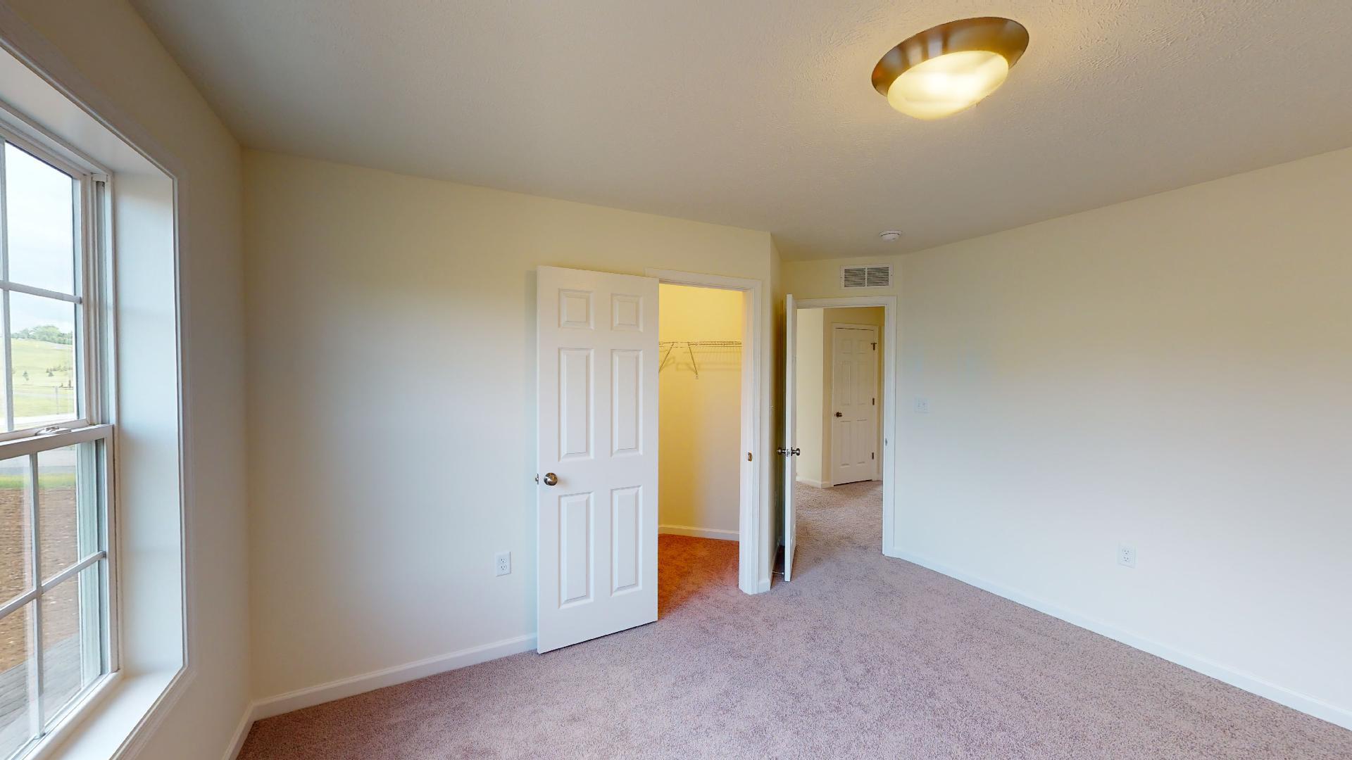 Bedroom 3 - facing doorways to hall and closet