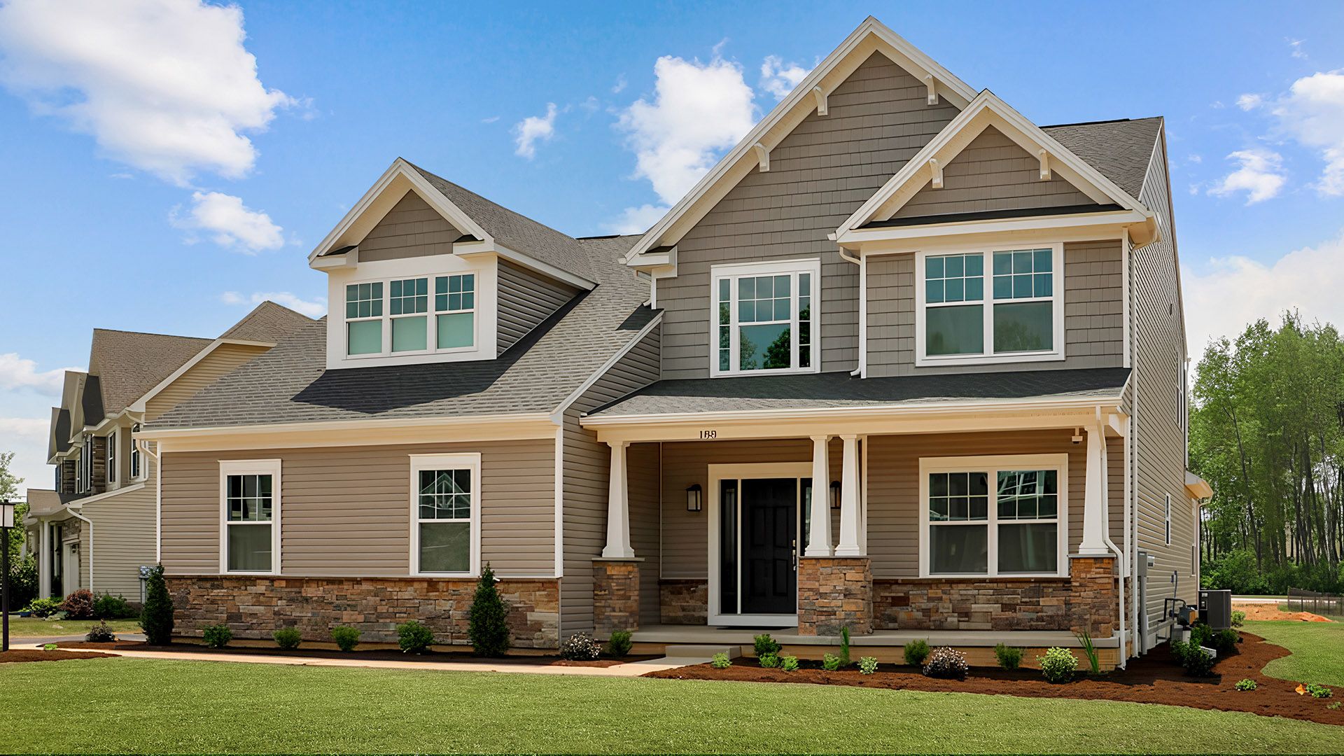 Front exterior view of the Bayberry C with full porch by S&A Homes - 2 story home with Craftsman design and side entry garage