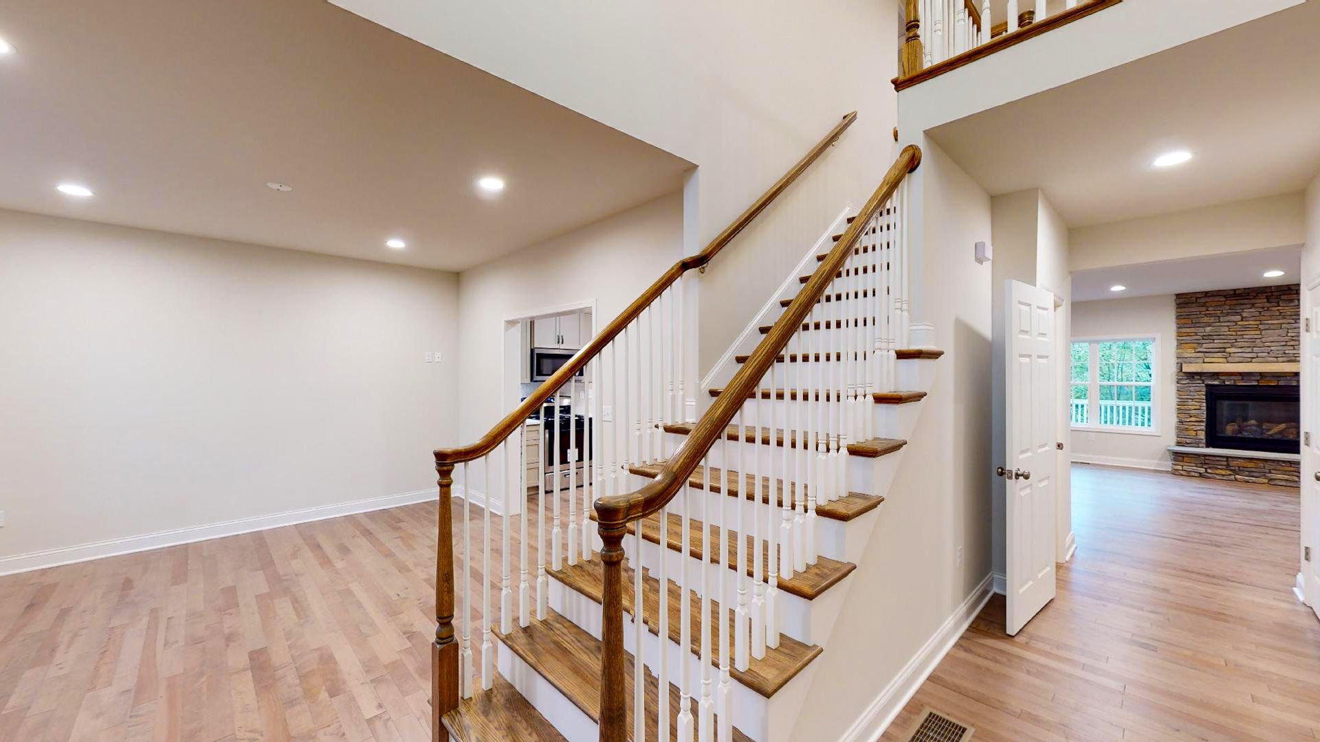 Foyer entry - stairs to 2nd level - oak treads with white risers