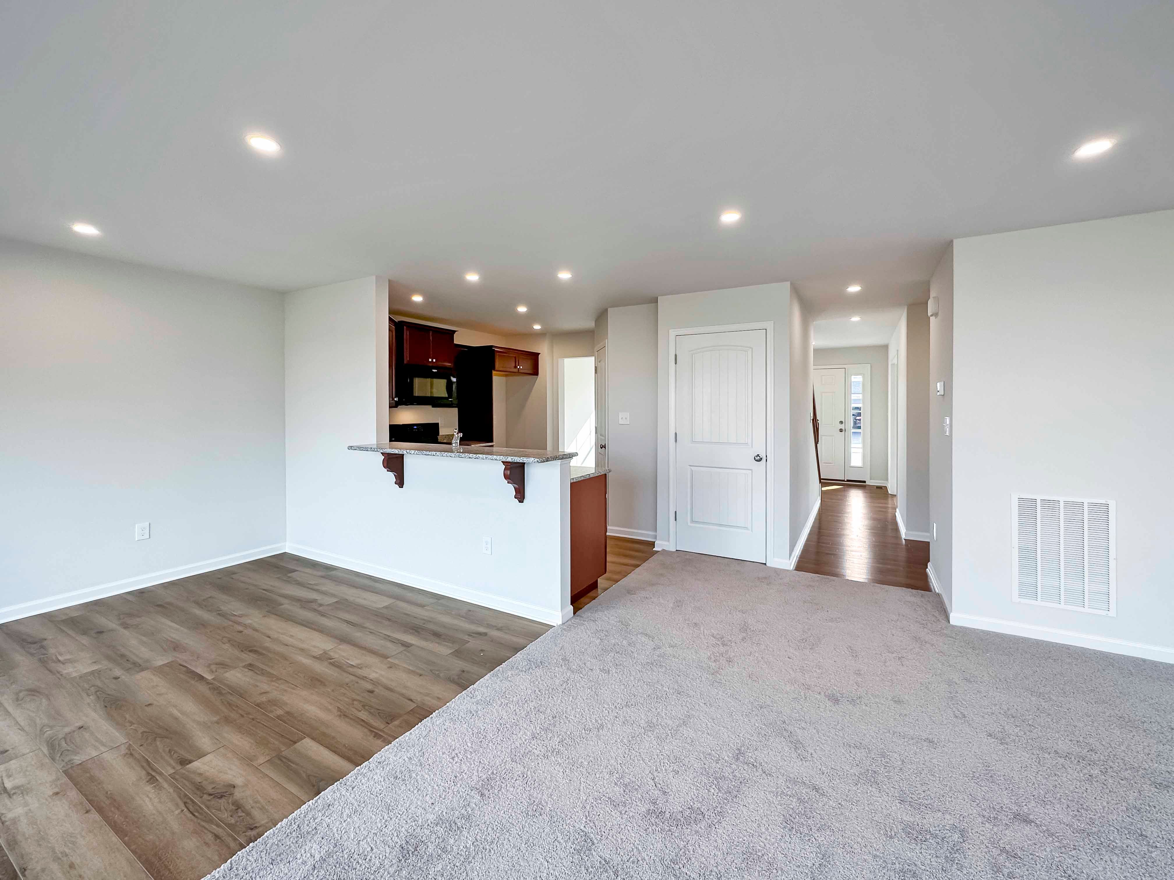 Family room, breakfast room and hallway to foyer