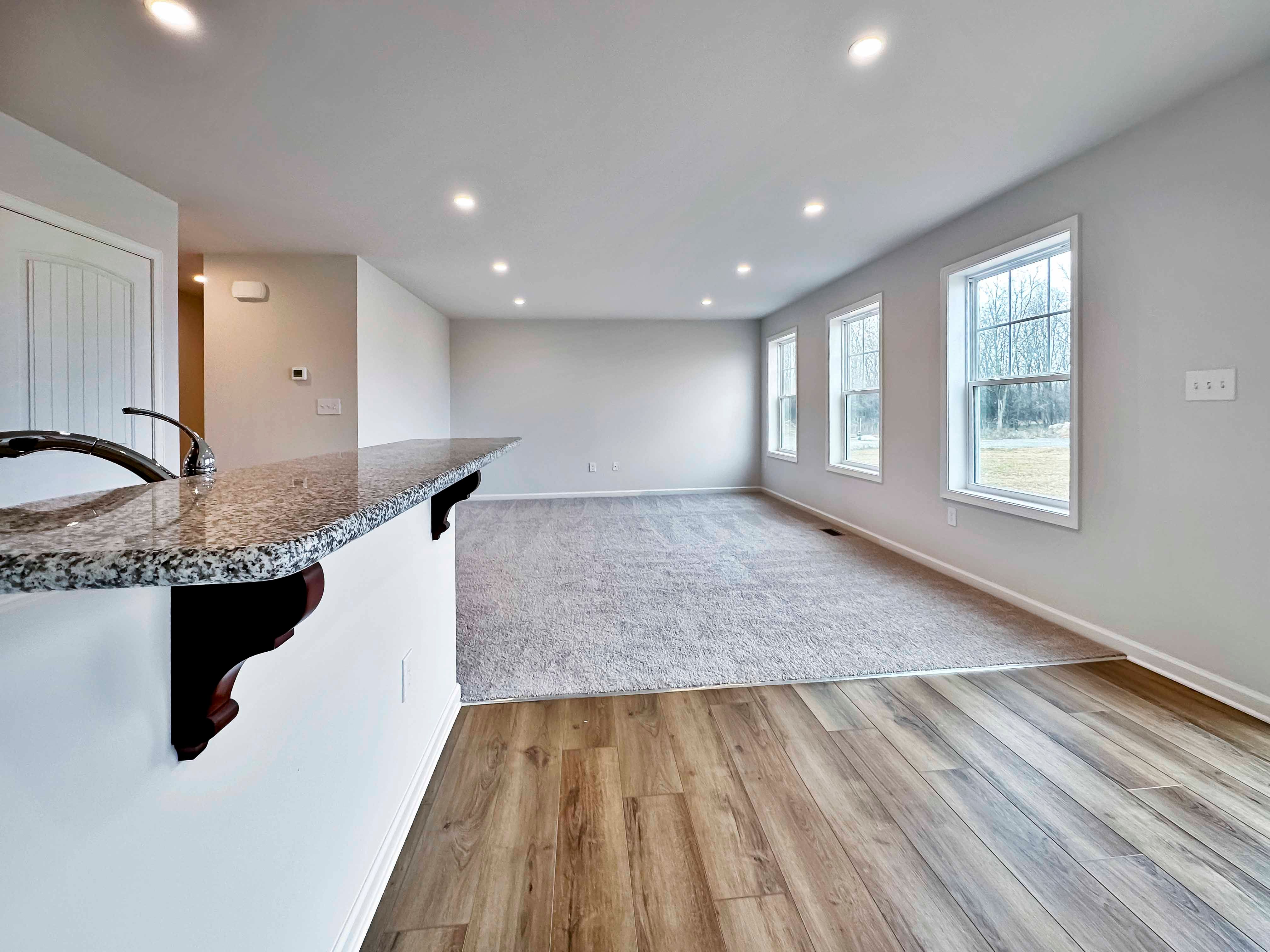 Granite bar overhang into breakfast area