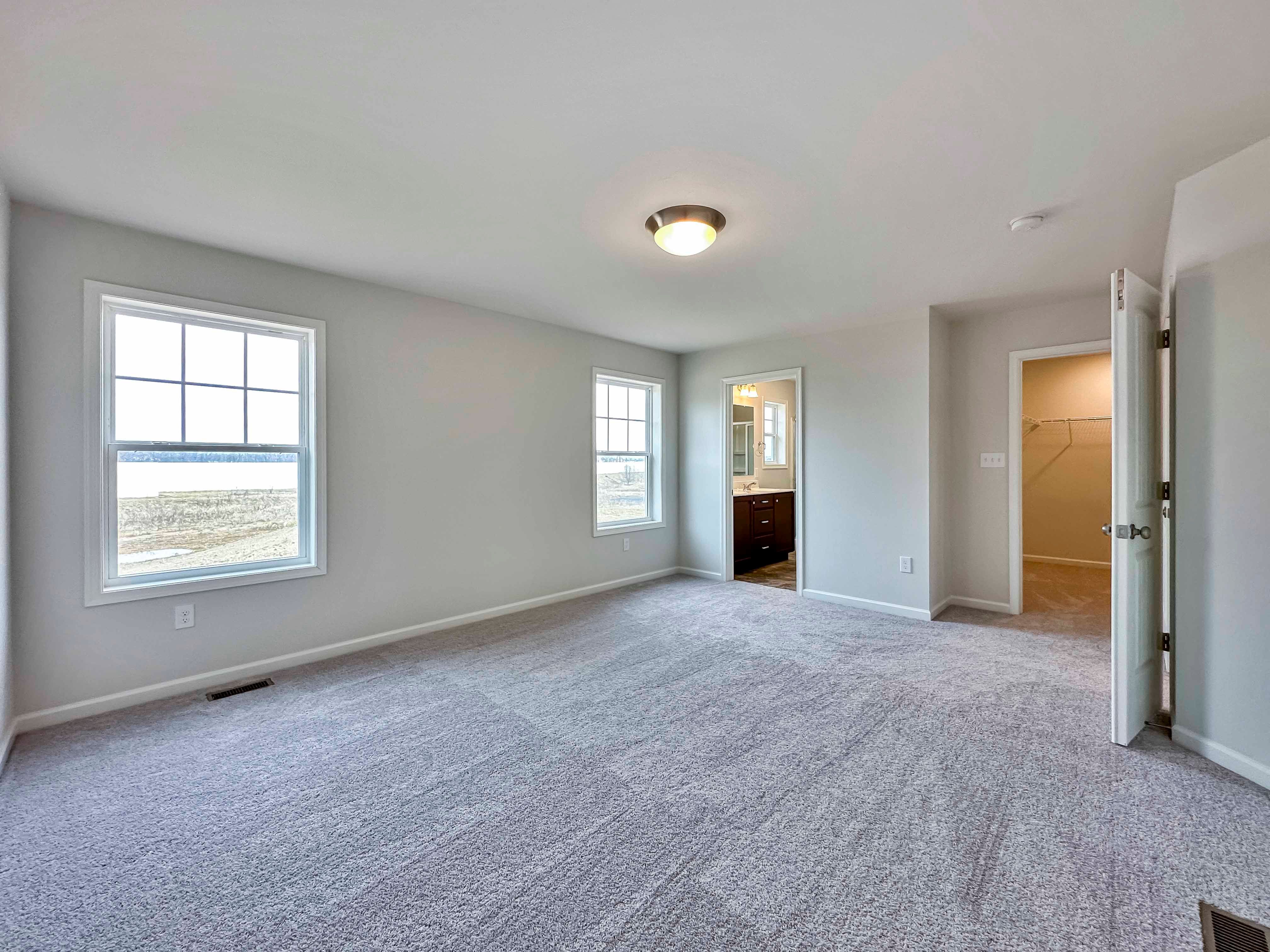 Owner's bedroom - facing doorways to bathroom and closet
