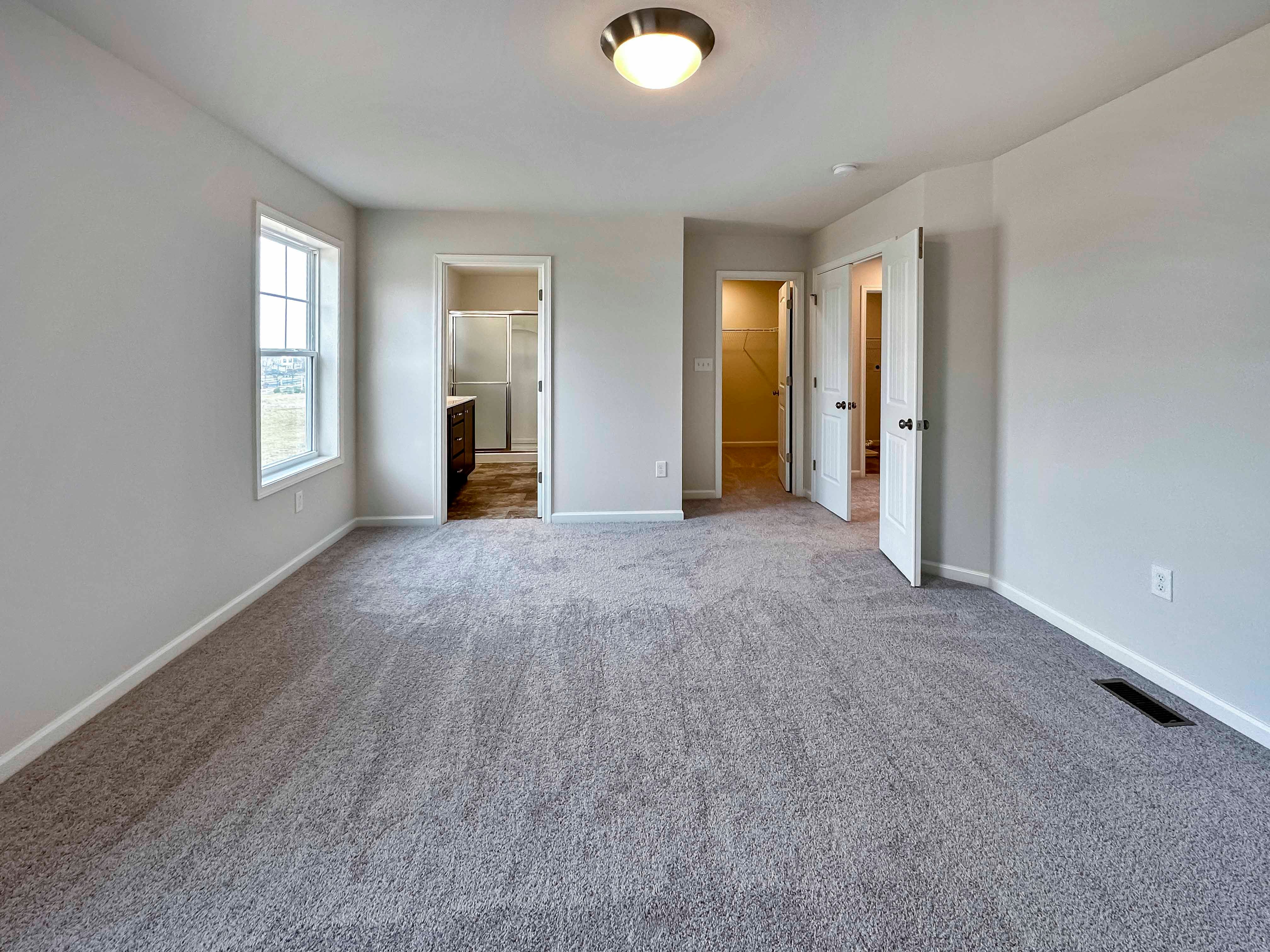 Owner's bedroom - facing doorways to bathroom and closet