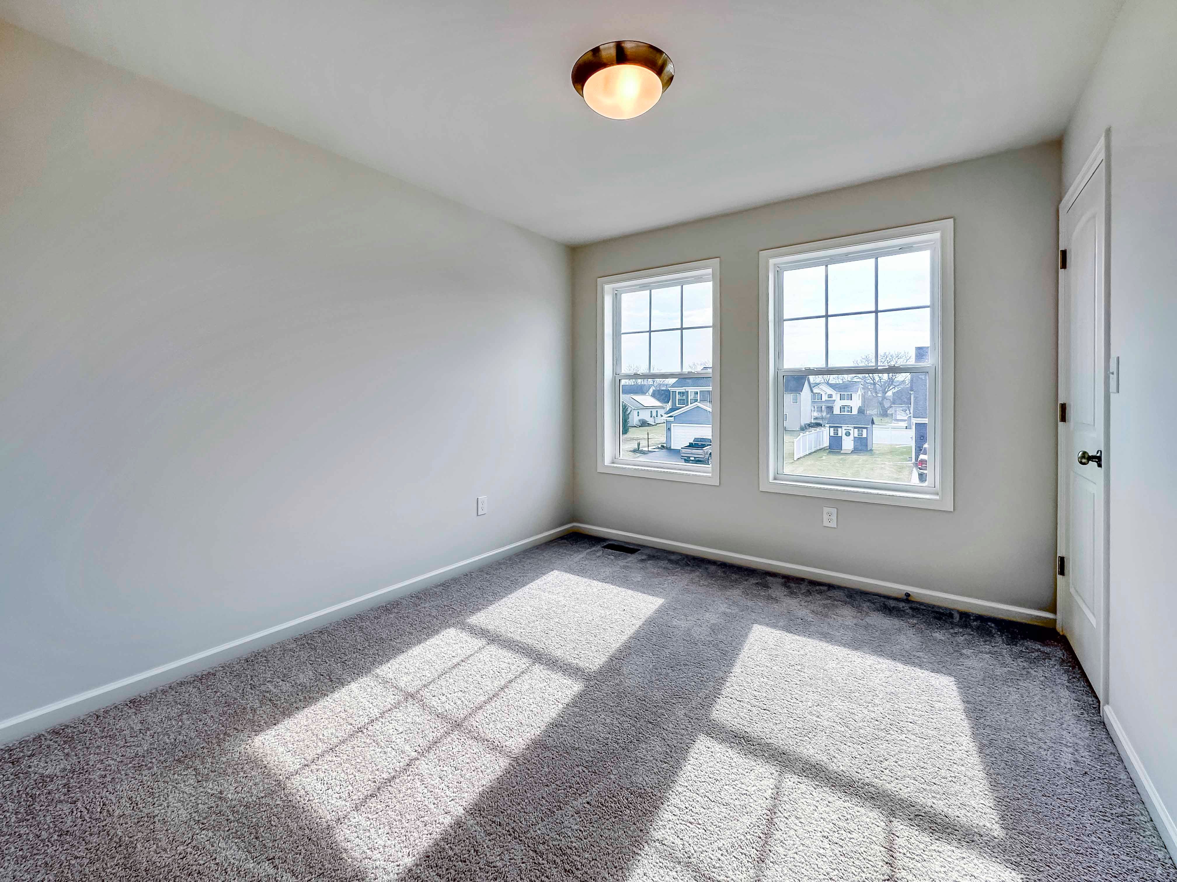 Bedroom with 2 windows on front wall
