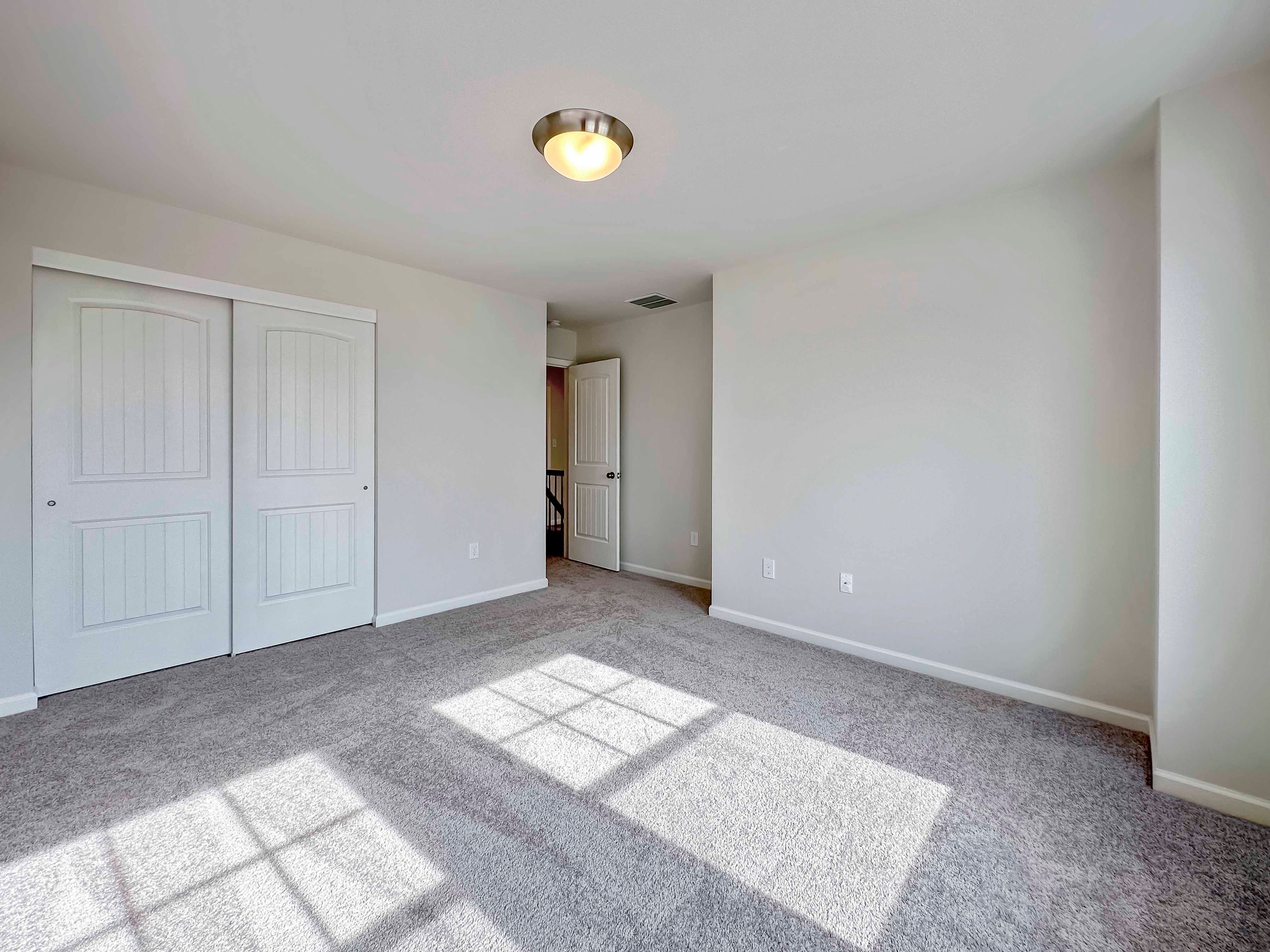 Bedroom- facing doorways to closet and hallway