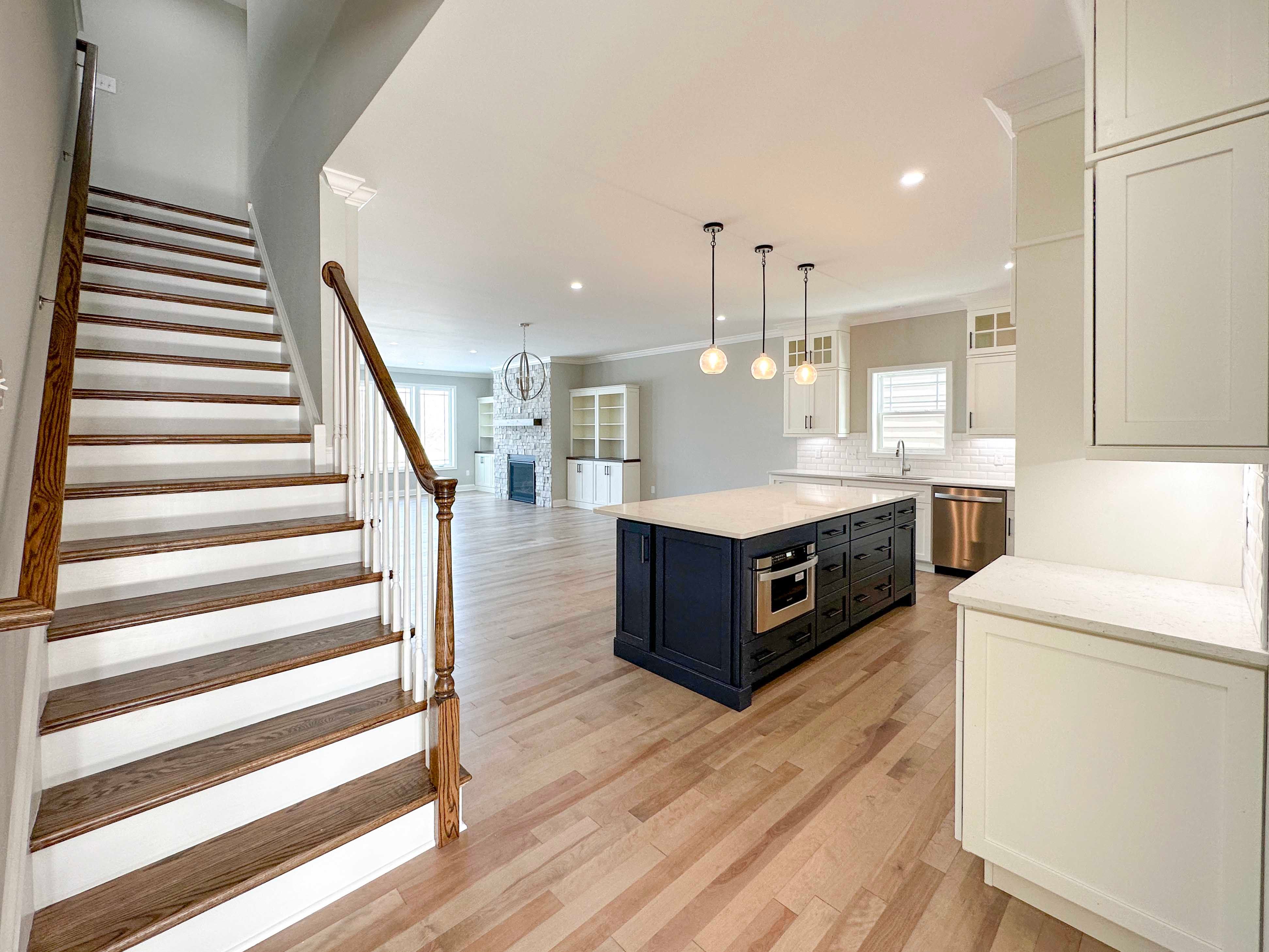 Foyer entry with hardwood stairs