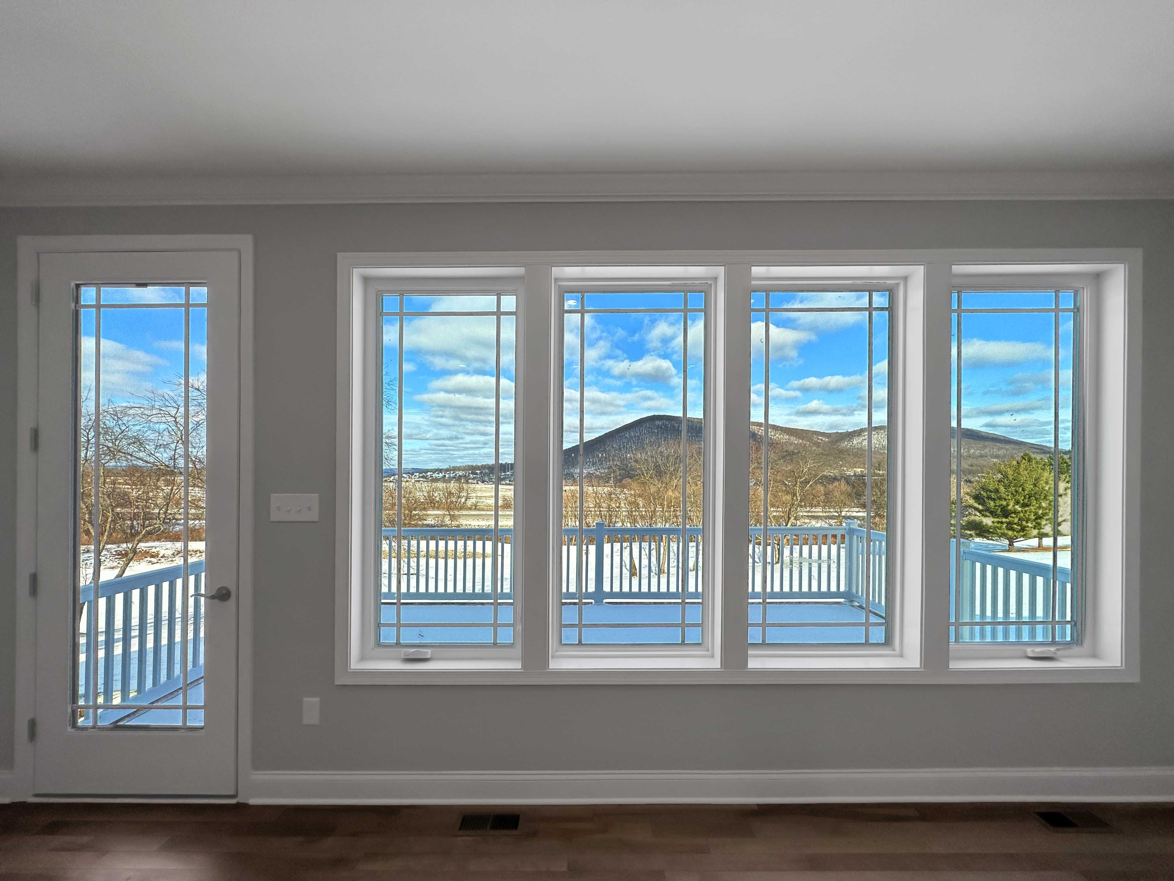 Wall of windows with view of Mt. Nittany