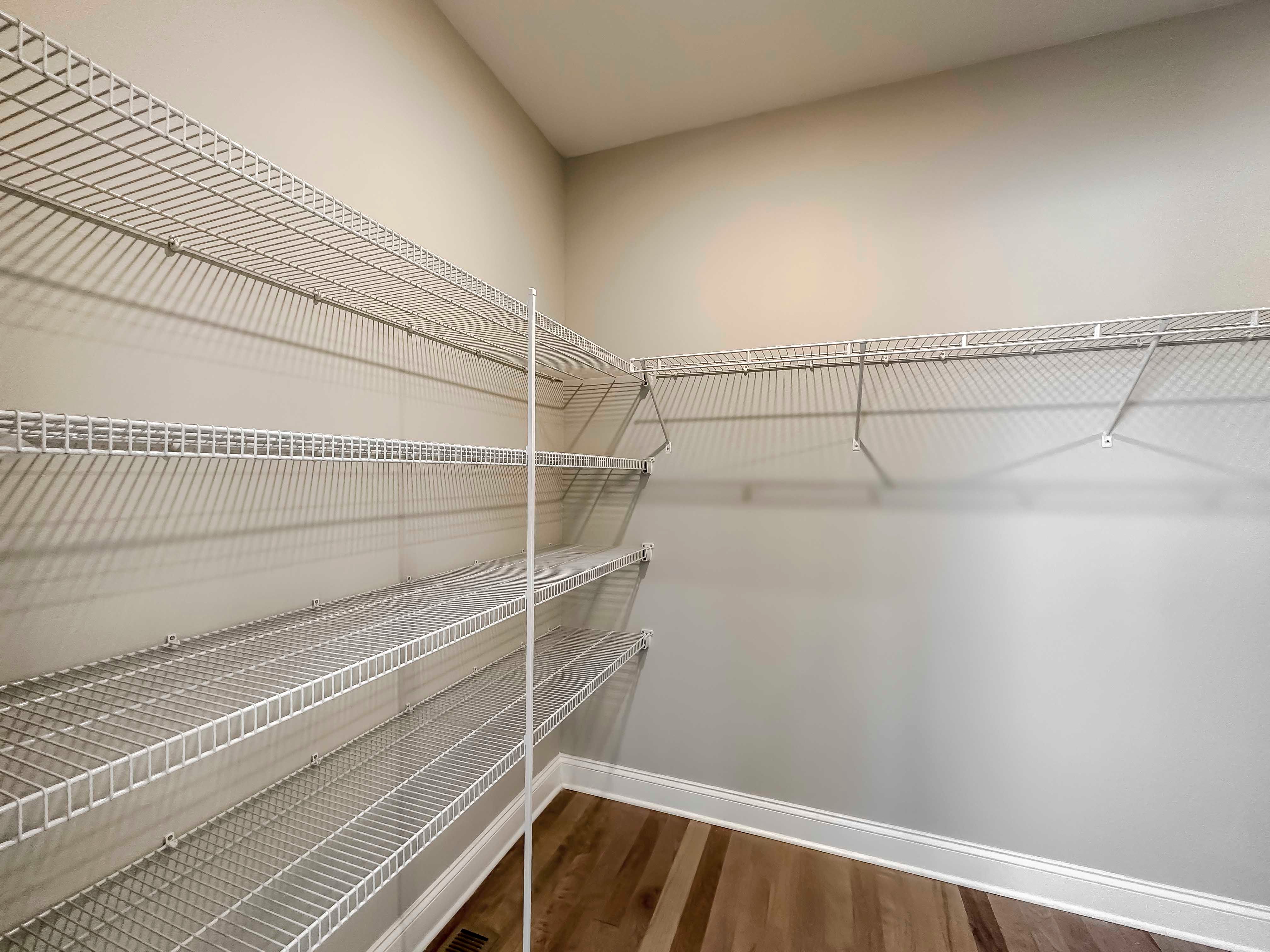 Closet with wire shelving and hardwood floor