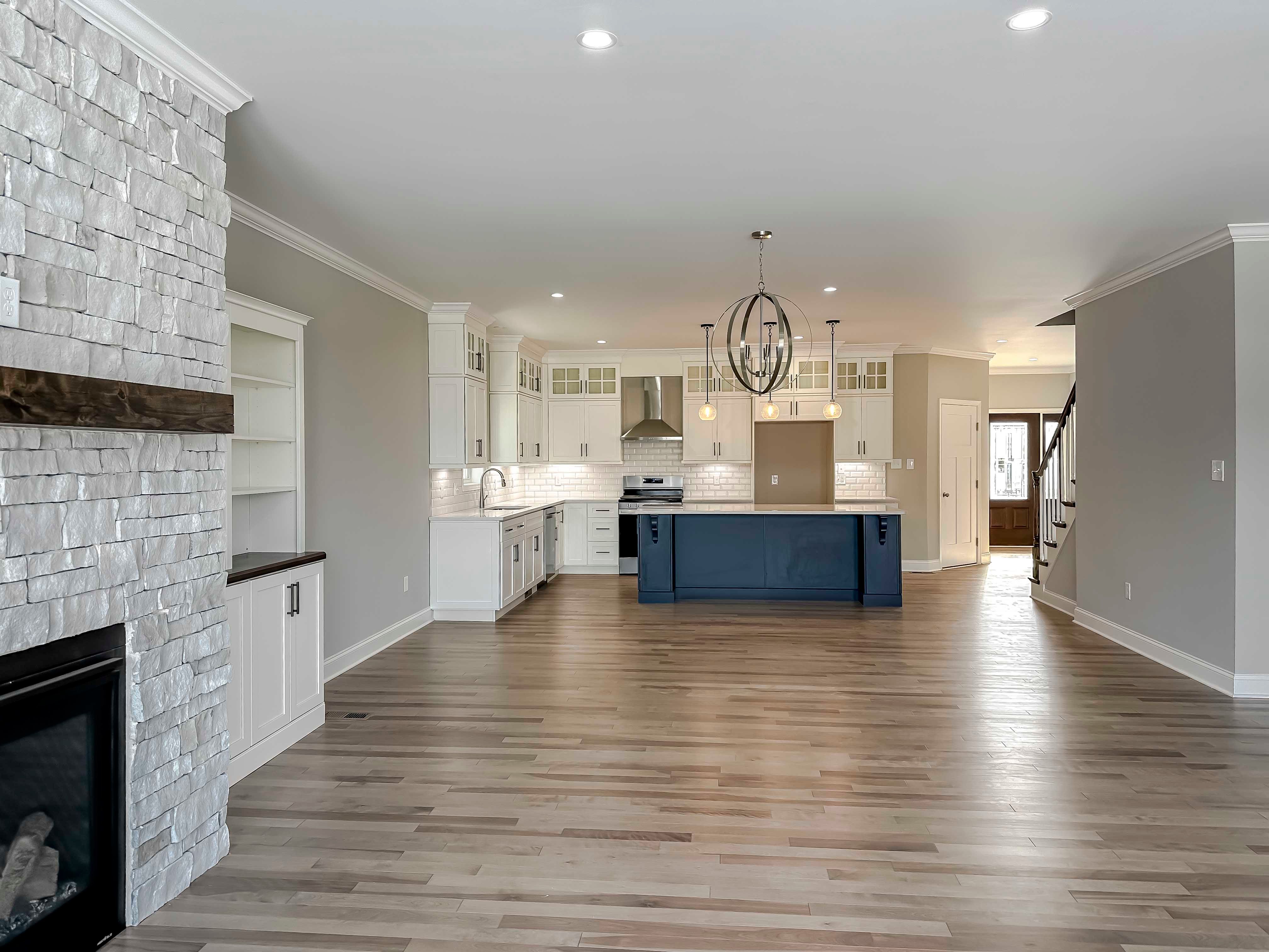 Family room with hardwood flooring - facing kitchen