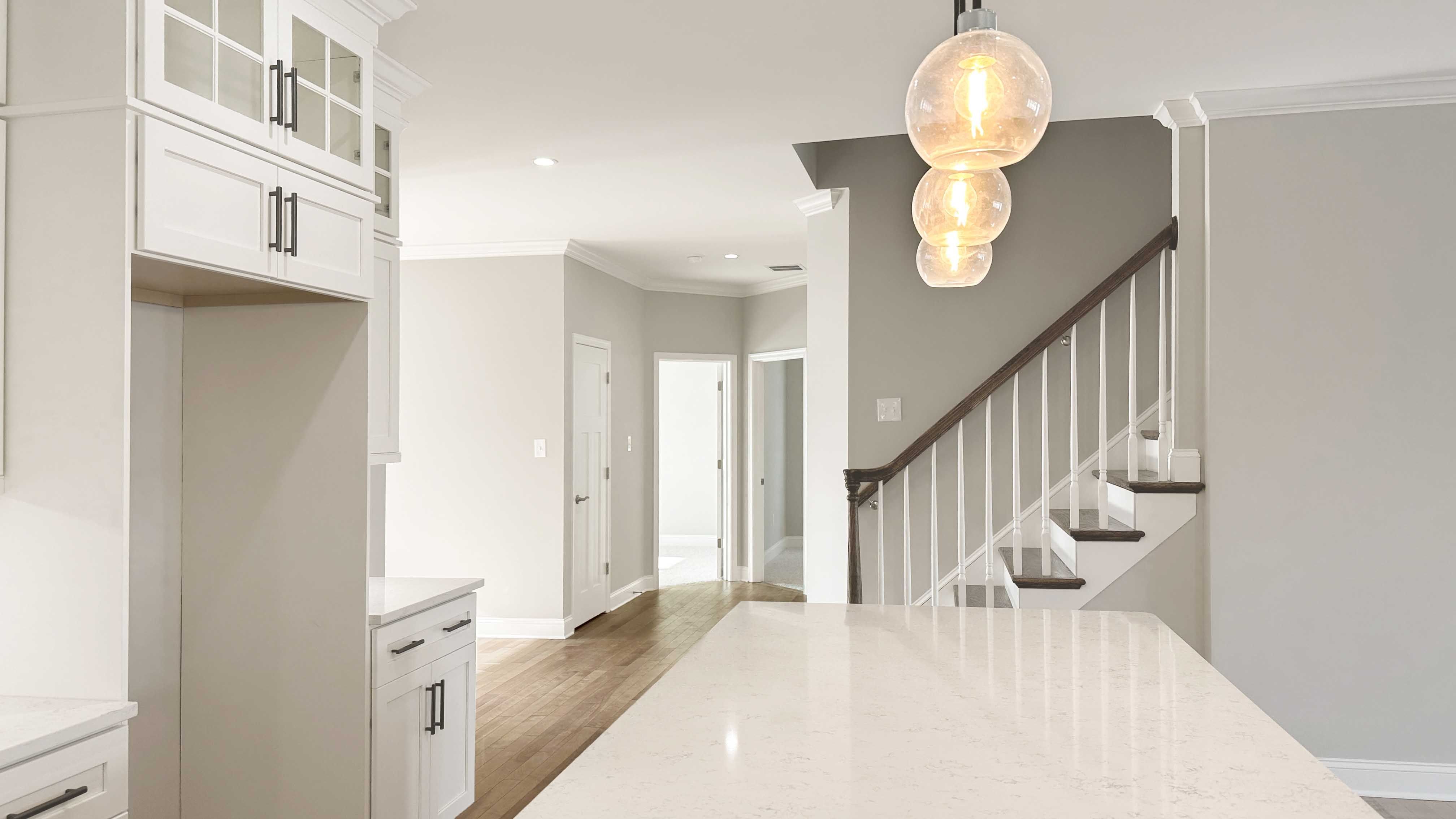 Quartz countertops in kitchen - facing hallway to bedrooms