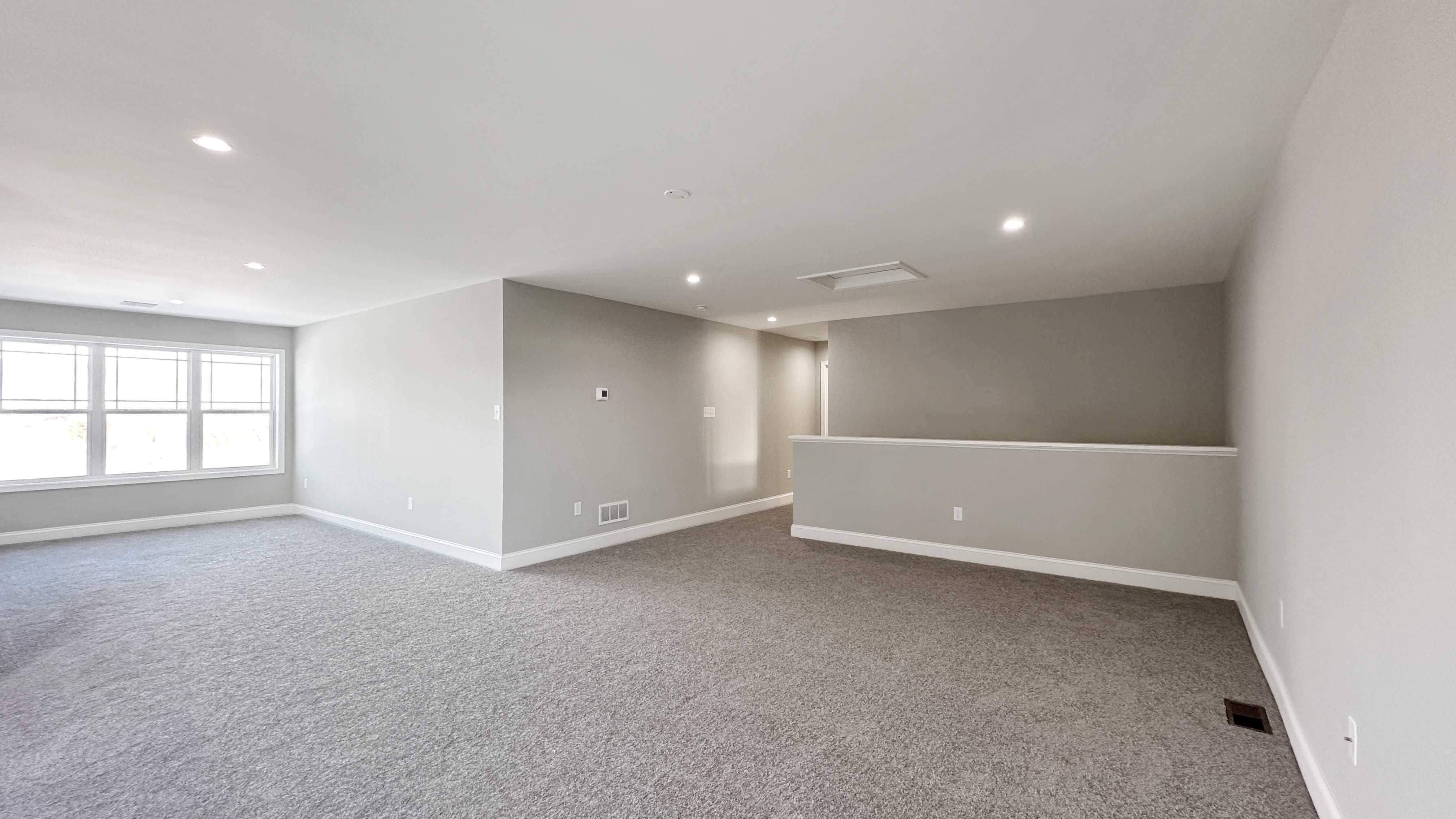 Loft area with dormer with triple windows