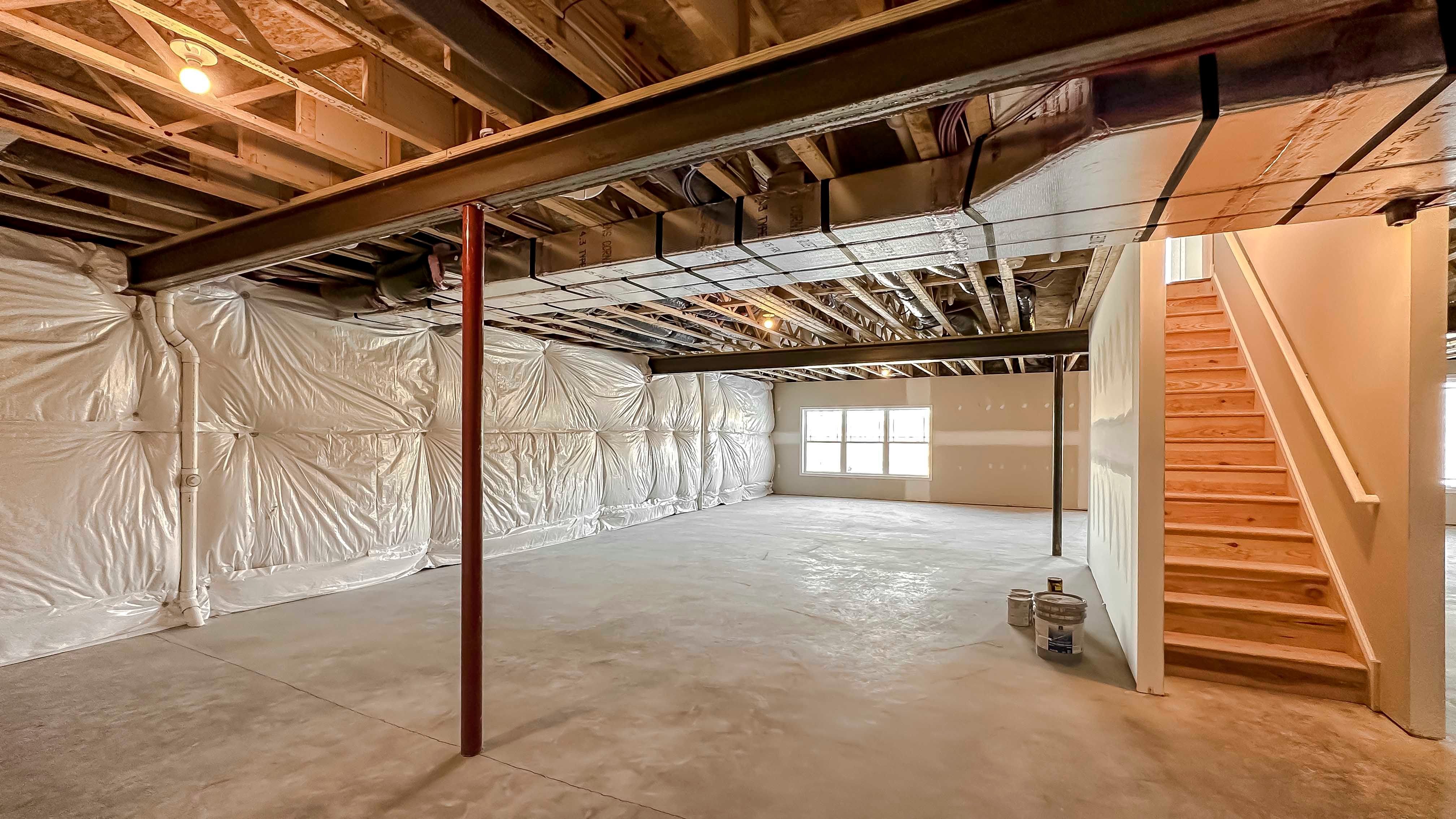 Unfinished basement with stairs to main level
