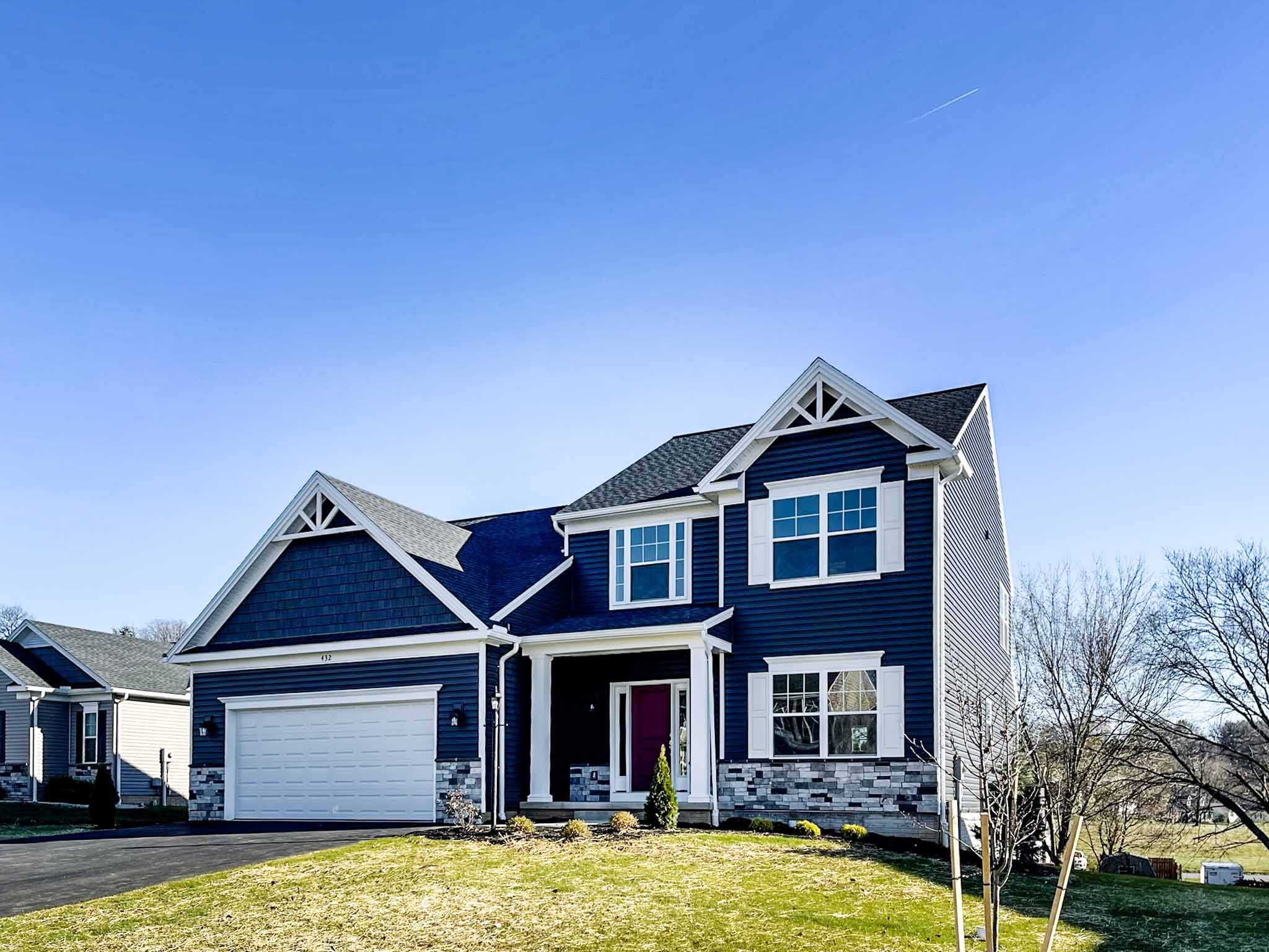 Bayberry B - front exterior - two story home with covered front entry and two car garage