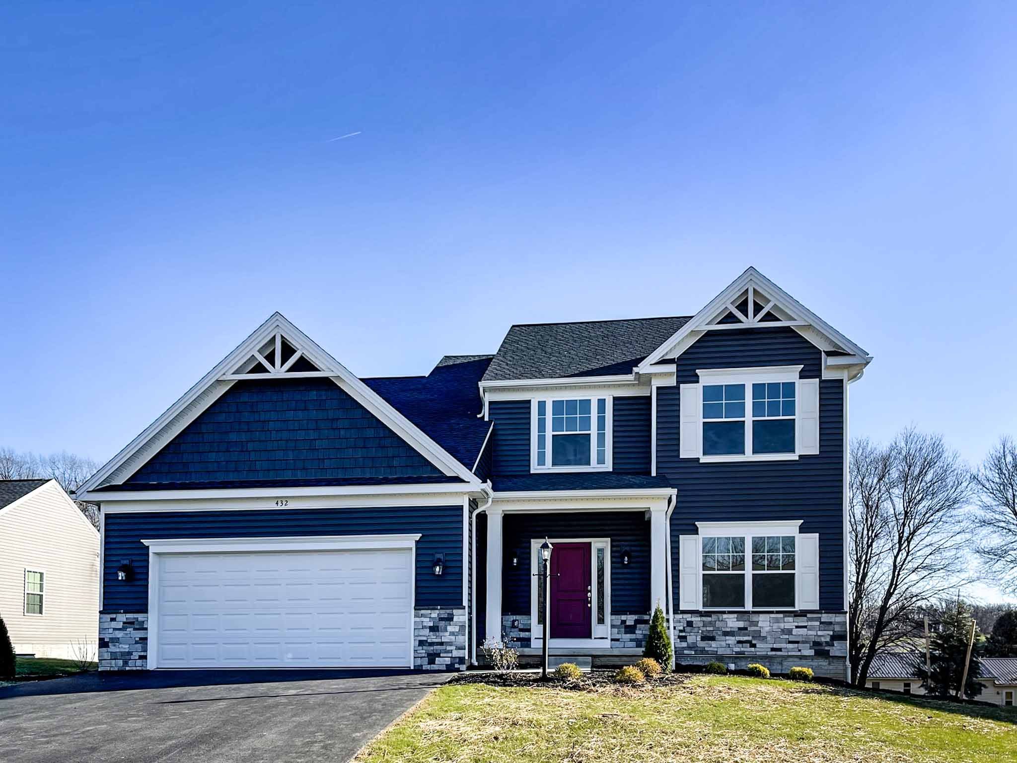 Bayberry B - front exterior - two story home with covered front entry and two car garage
