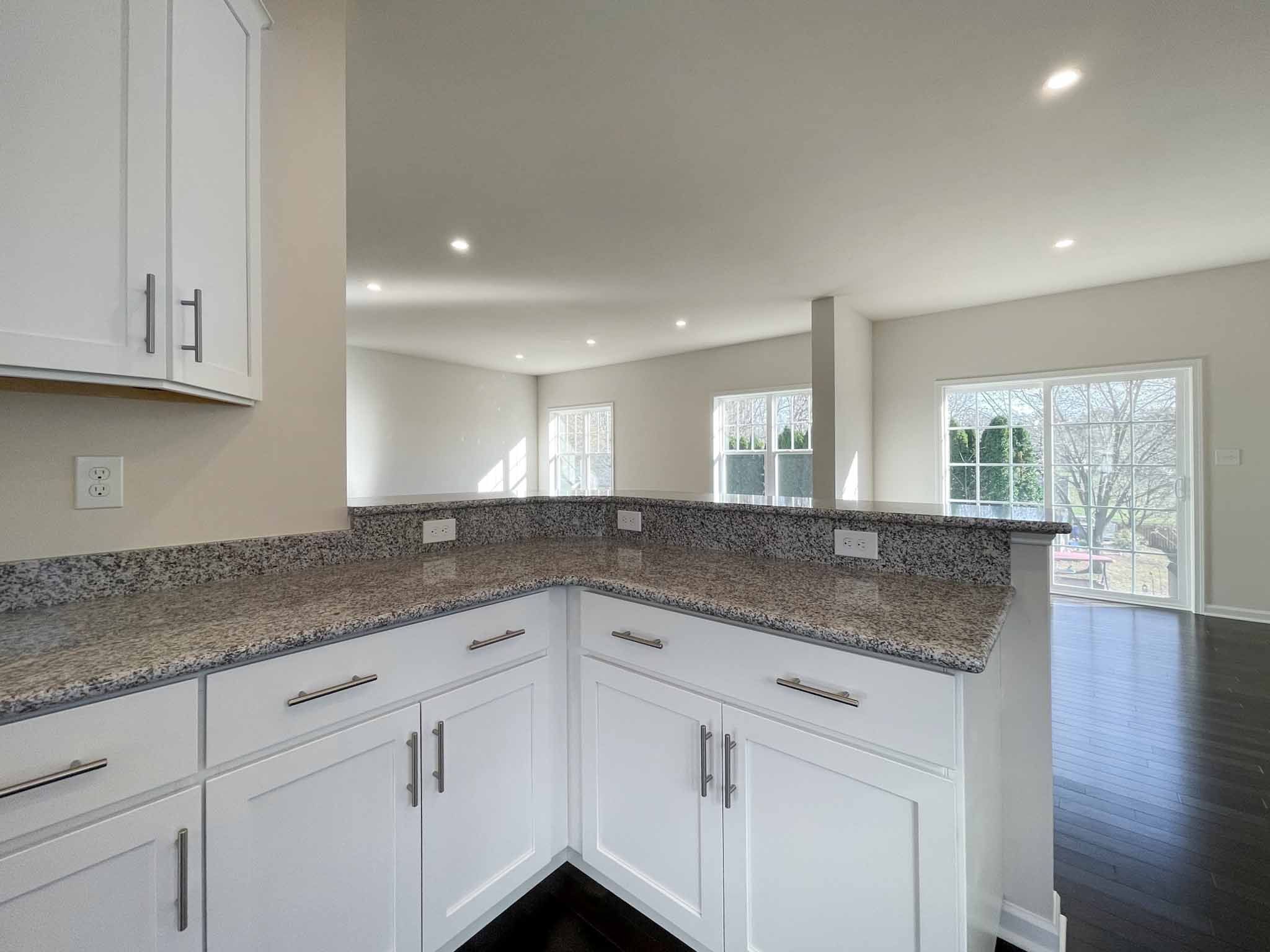 Kitchen cabinets with raised bar overhang