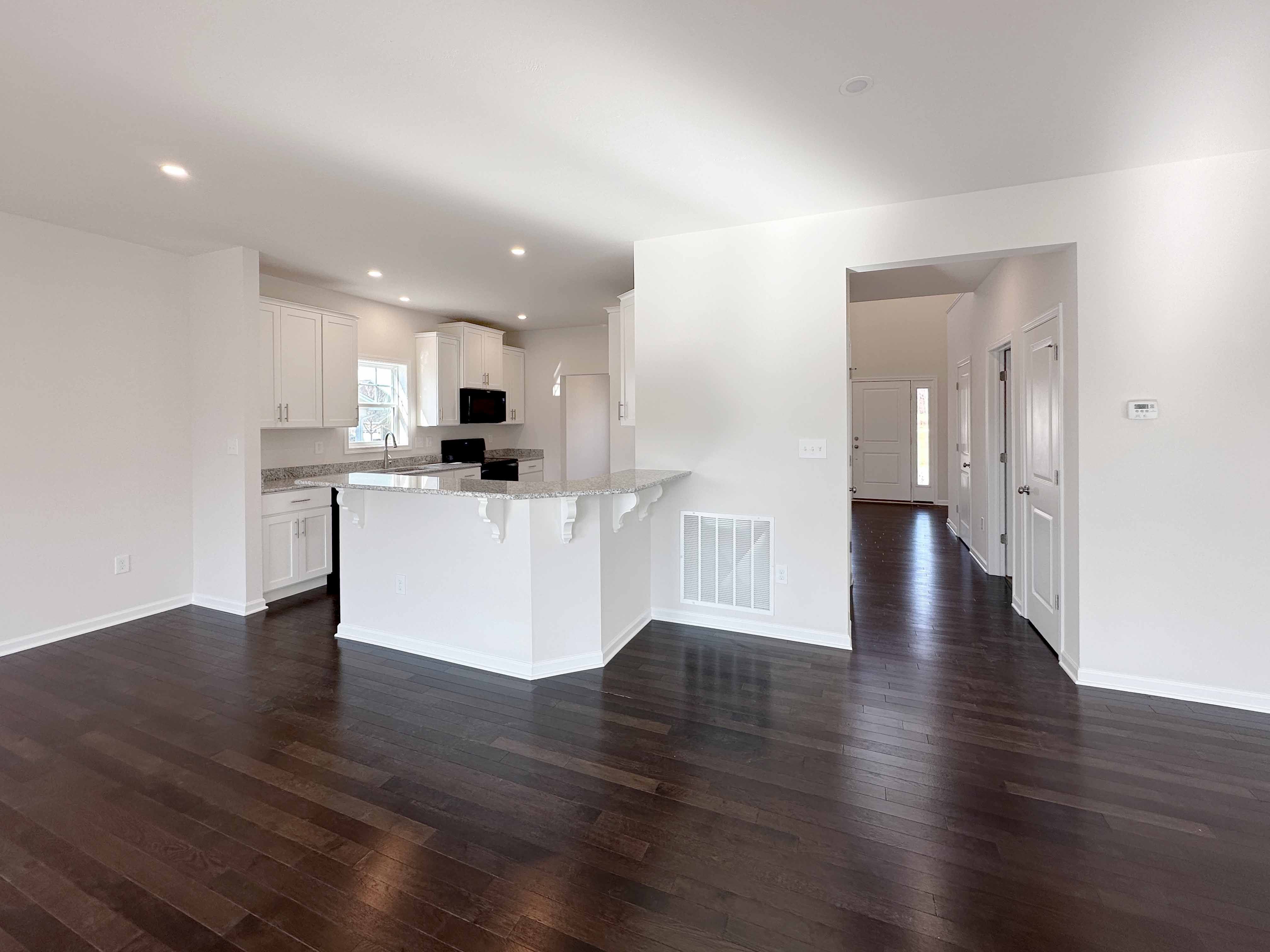 Facing kitchen and foyer hall