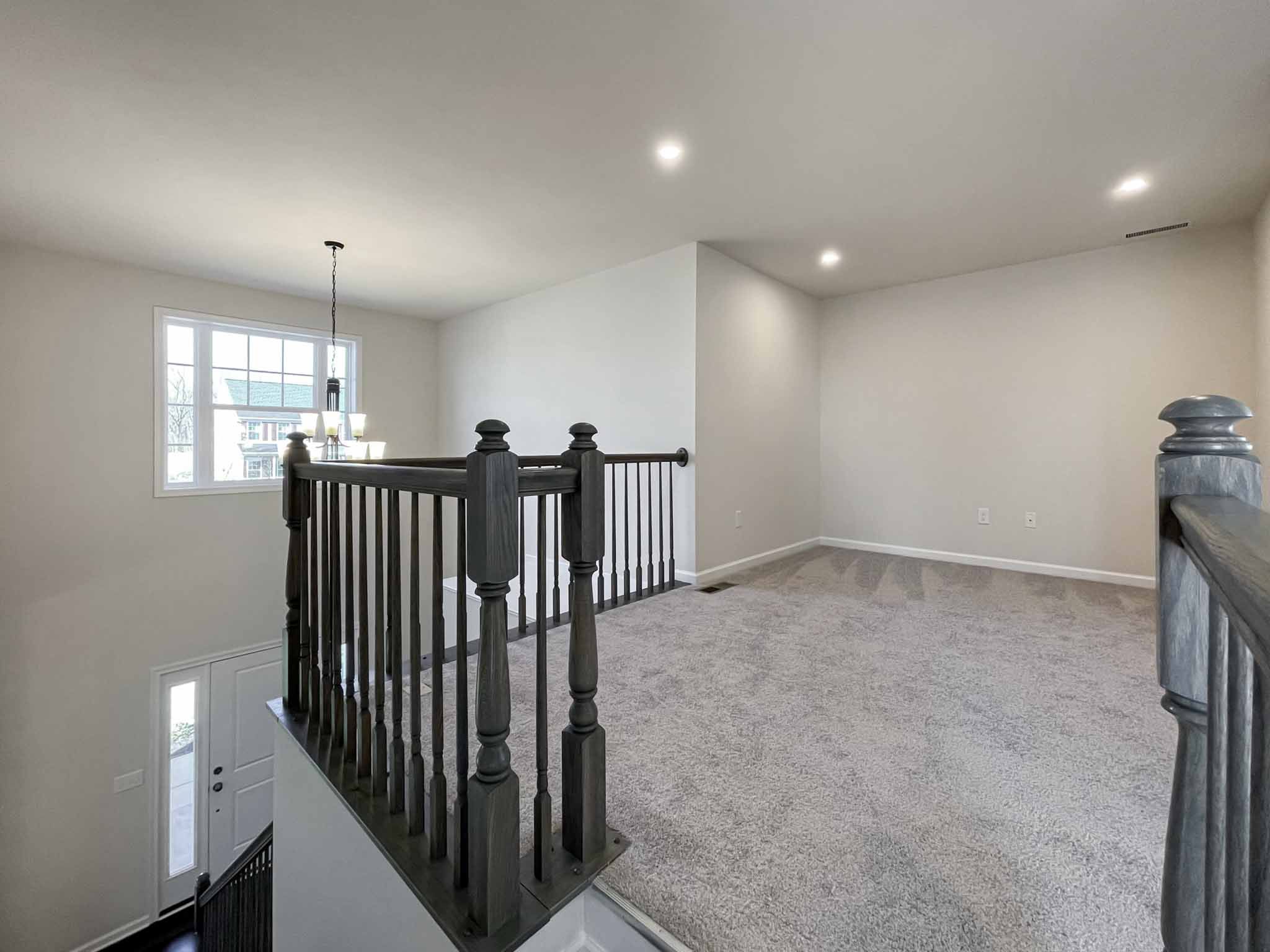 Loft area with carpet flooring