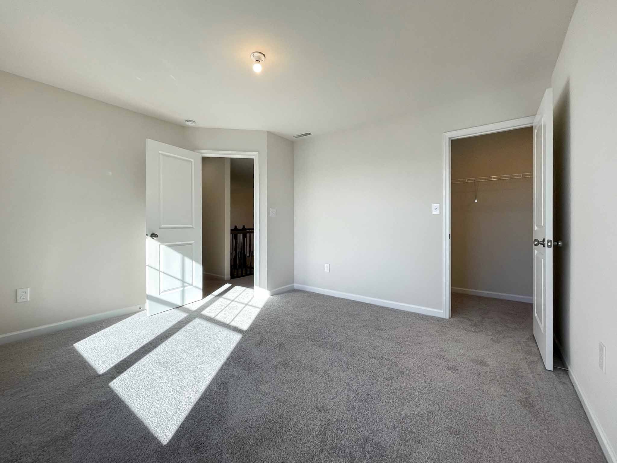 Bedroom - facing doorways to hall and closet