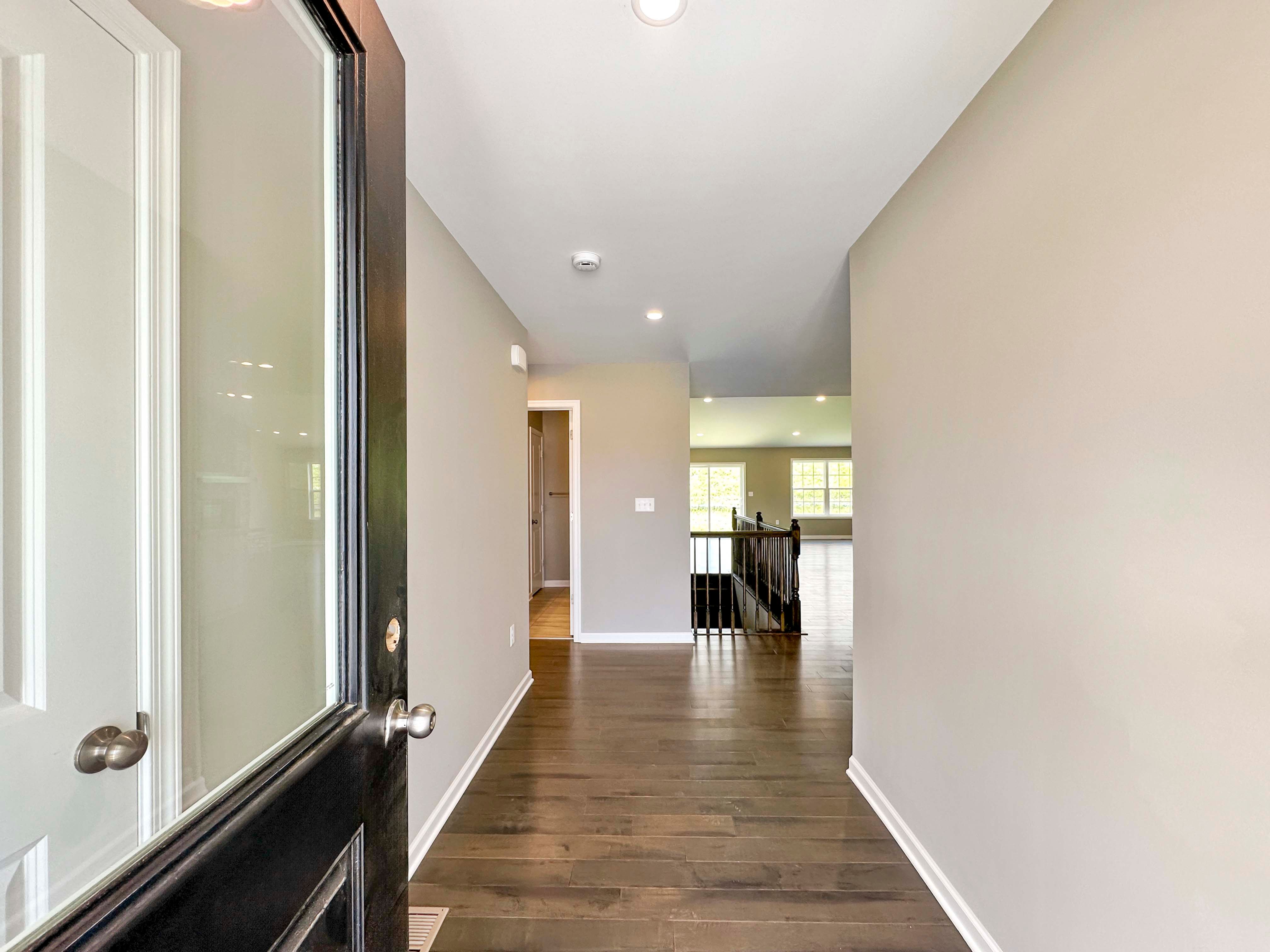 Foyer entry with hardwood flooring