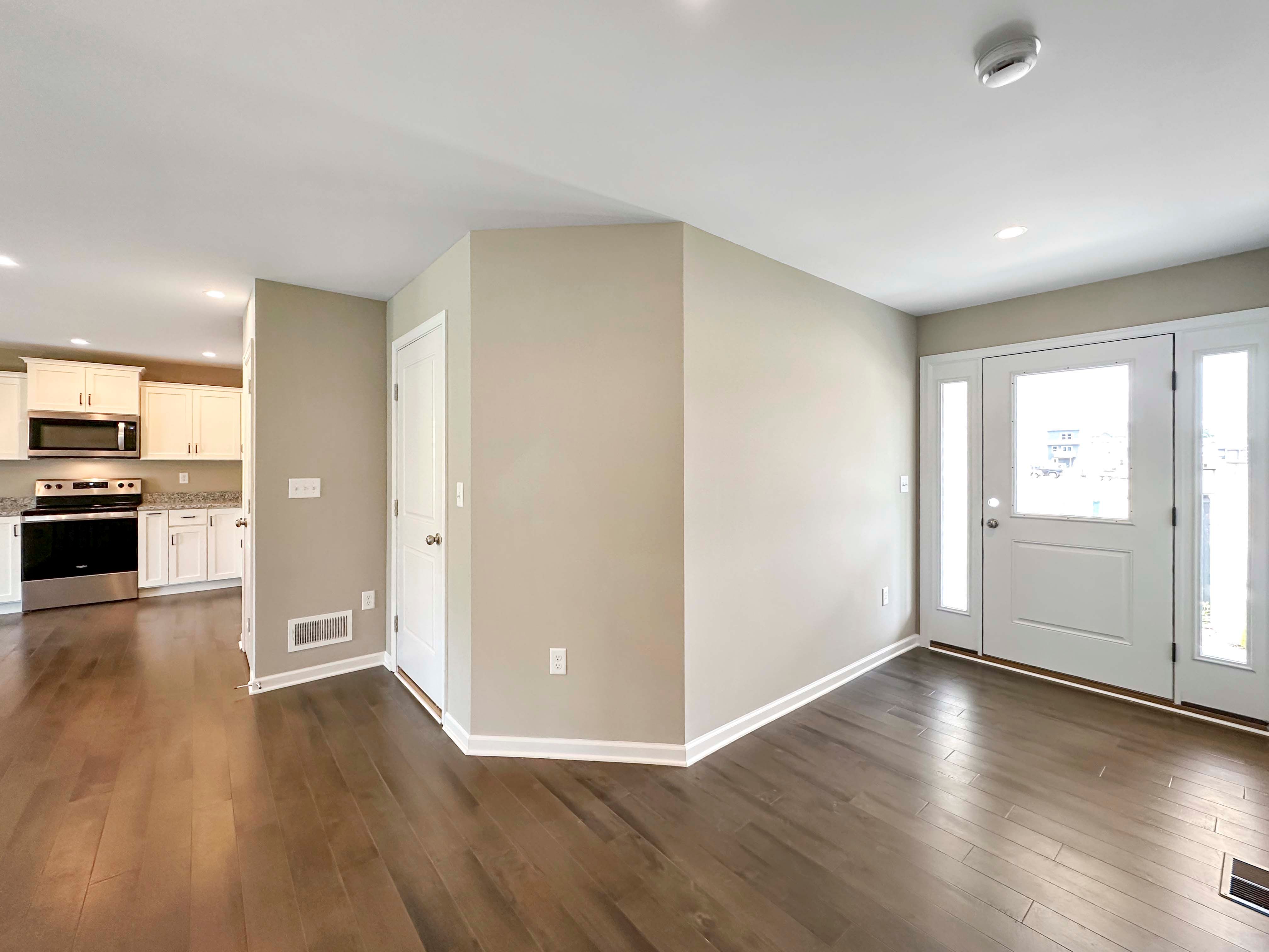 Foyer entry with hardwood flooring