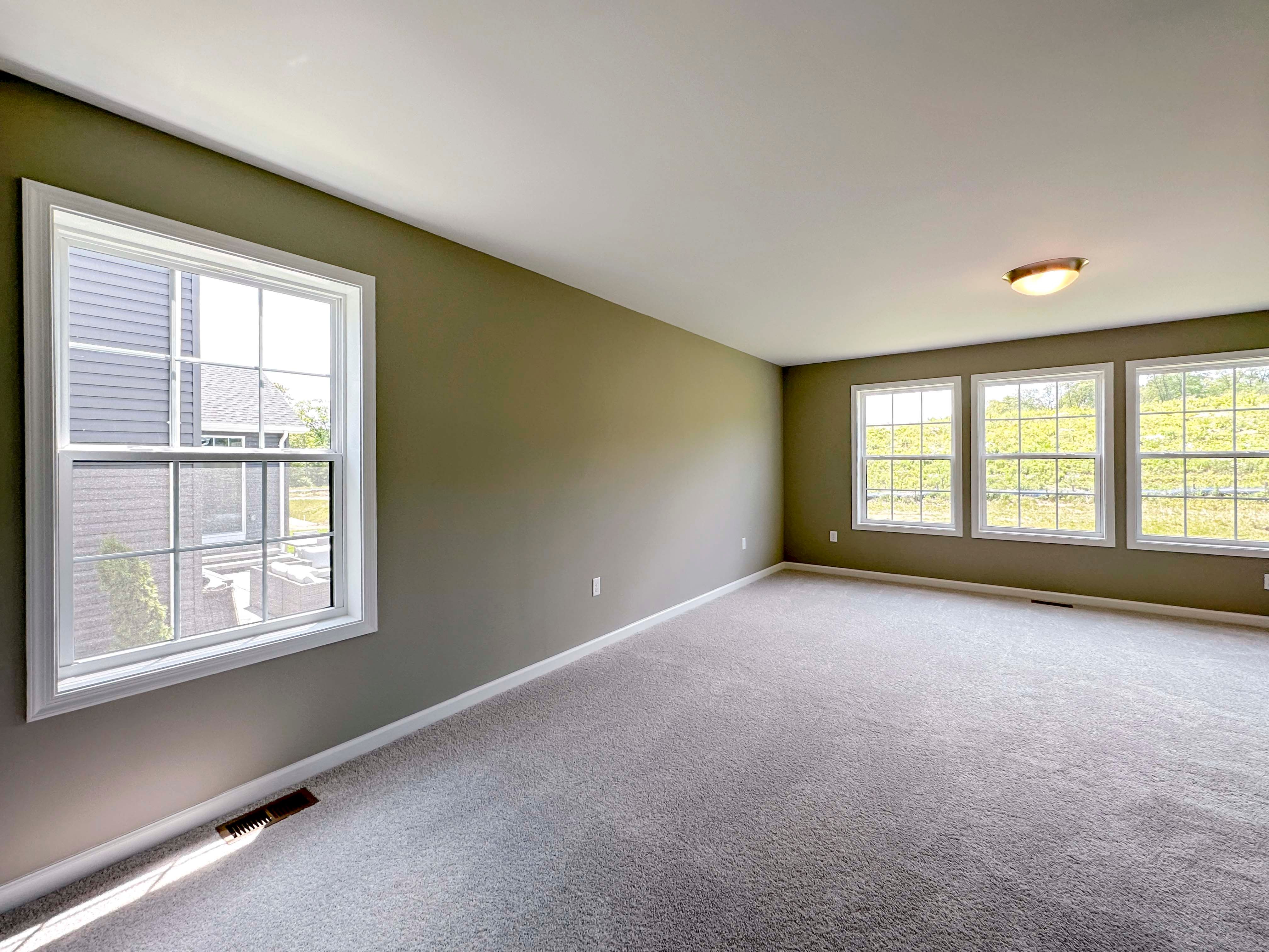 Unfurnished bedroom with carpet flooring