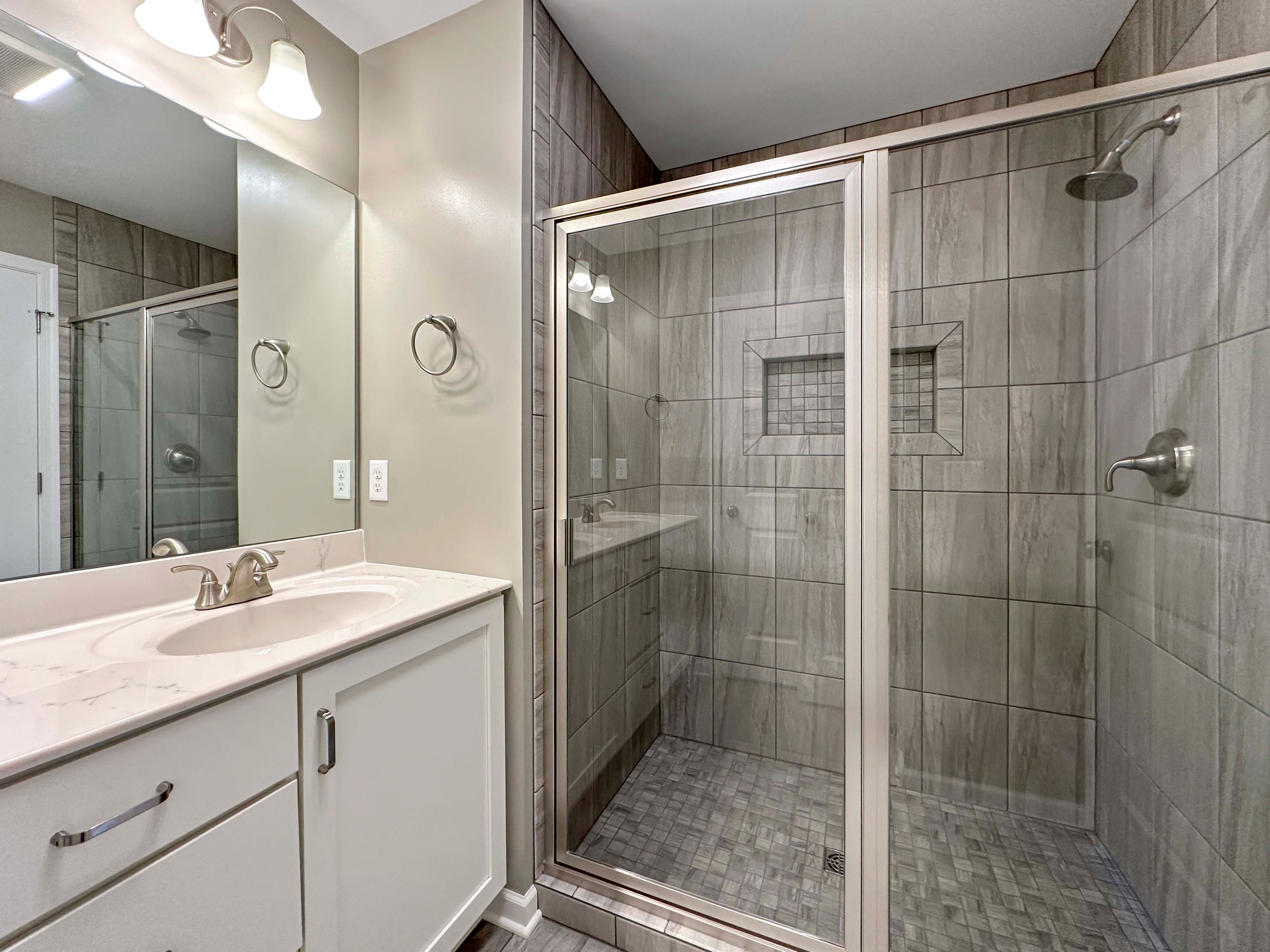 Bathroom with ceramic tile shower