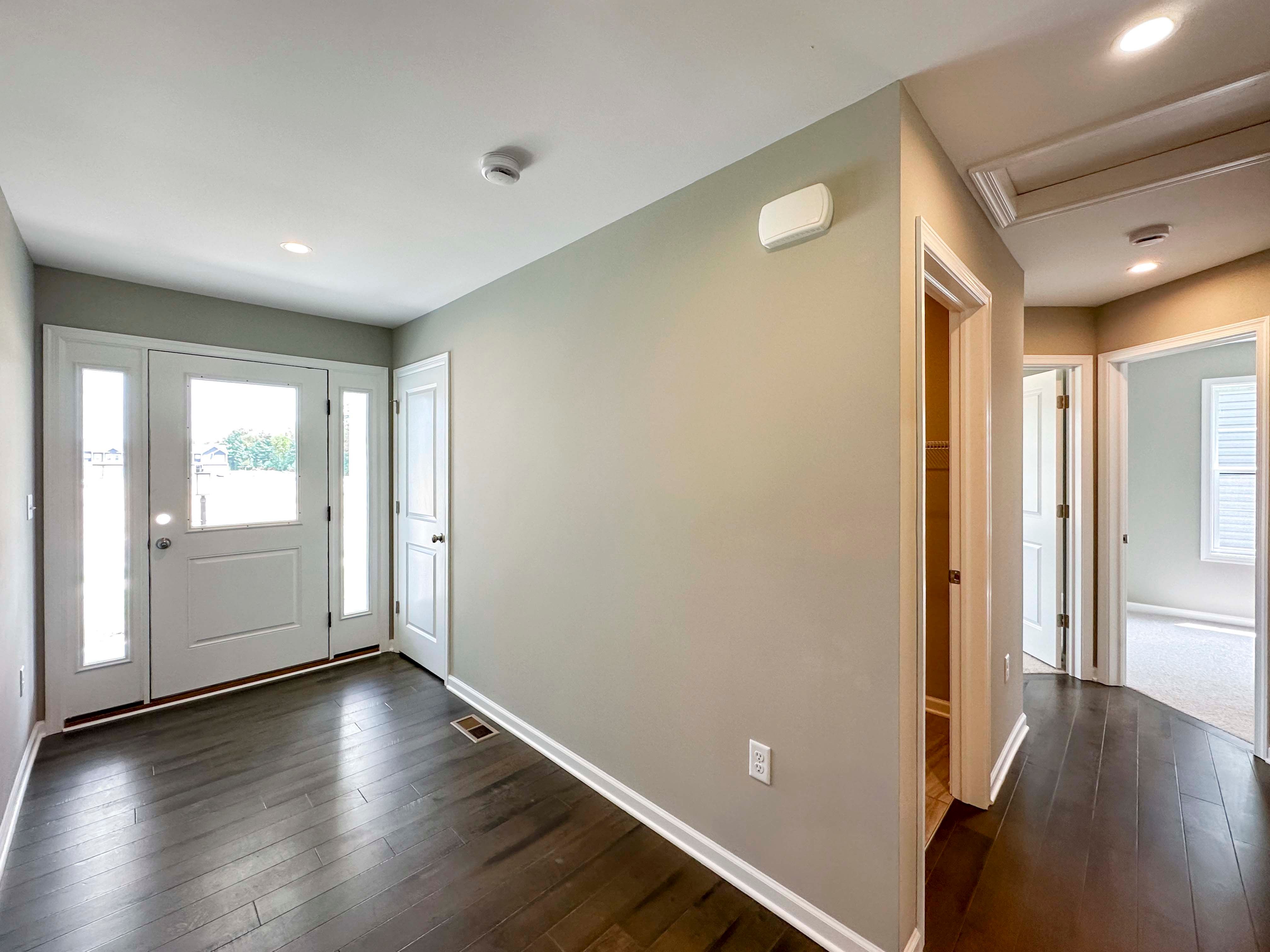 Foyer entry with hardwood flooring