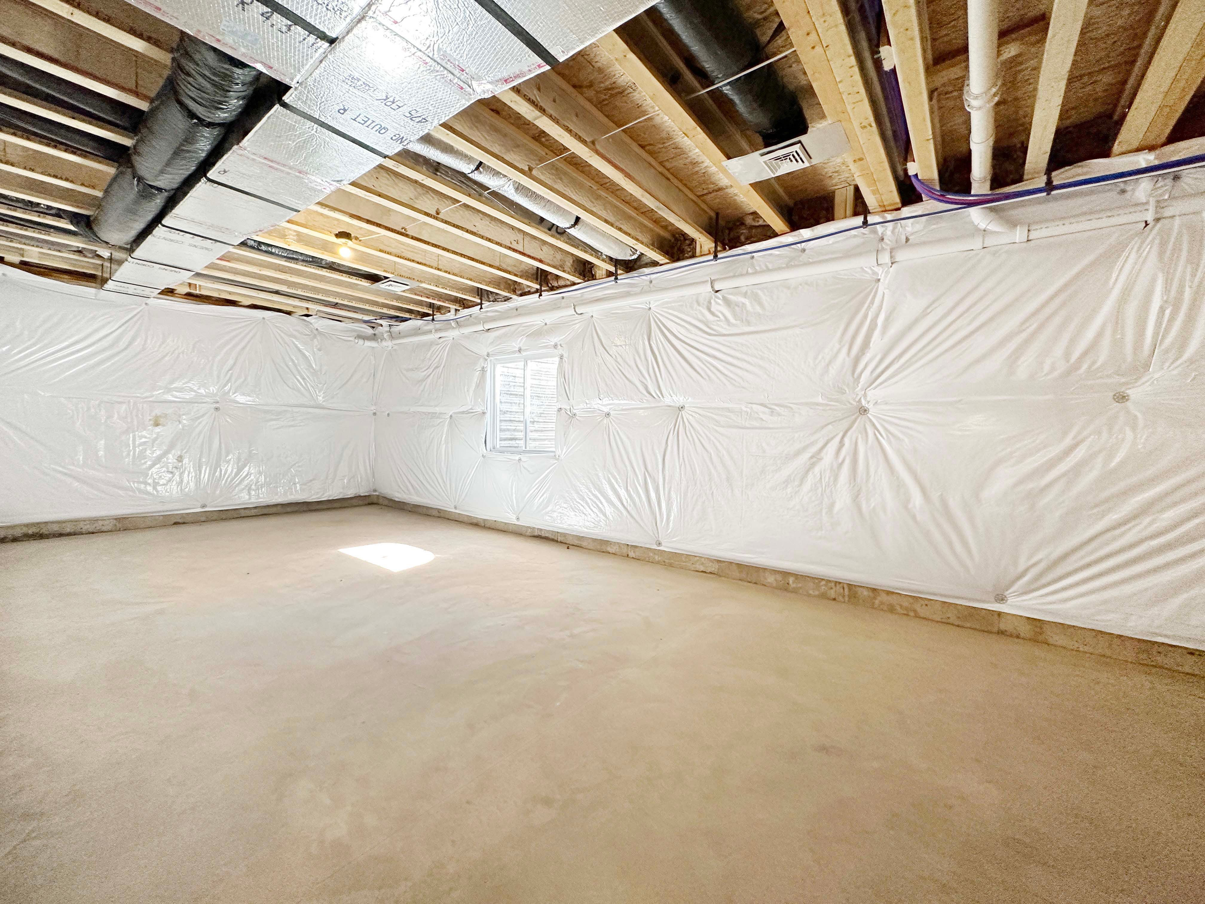 Unfinished Basement- concrete floor, I-joist floor system above.