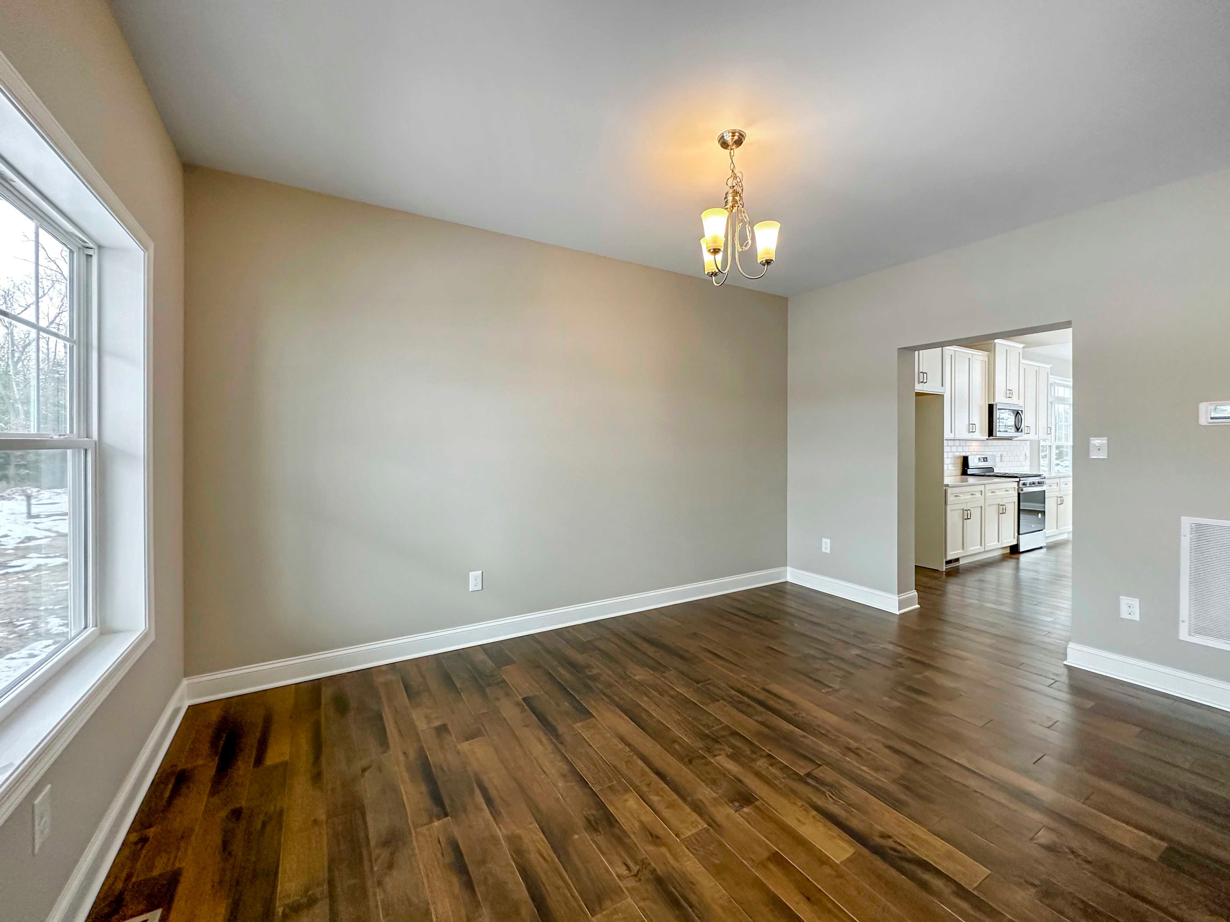 Dining Room - Formal dining room with double pane window facing front of home onlooking front porch, entryway to kitchen on right wall.