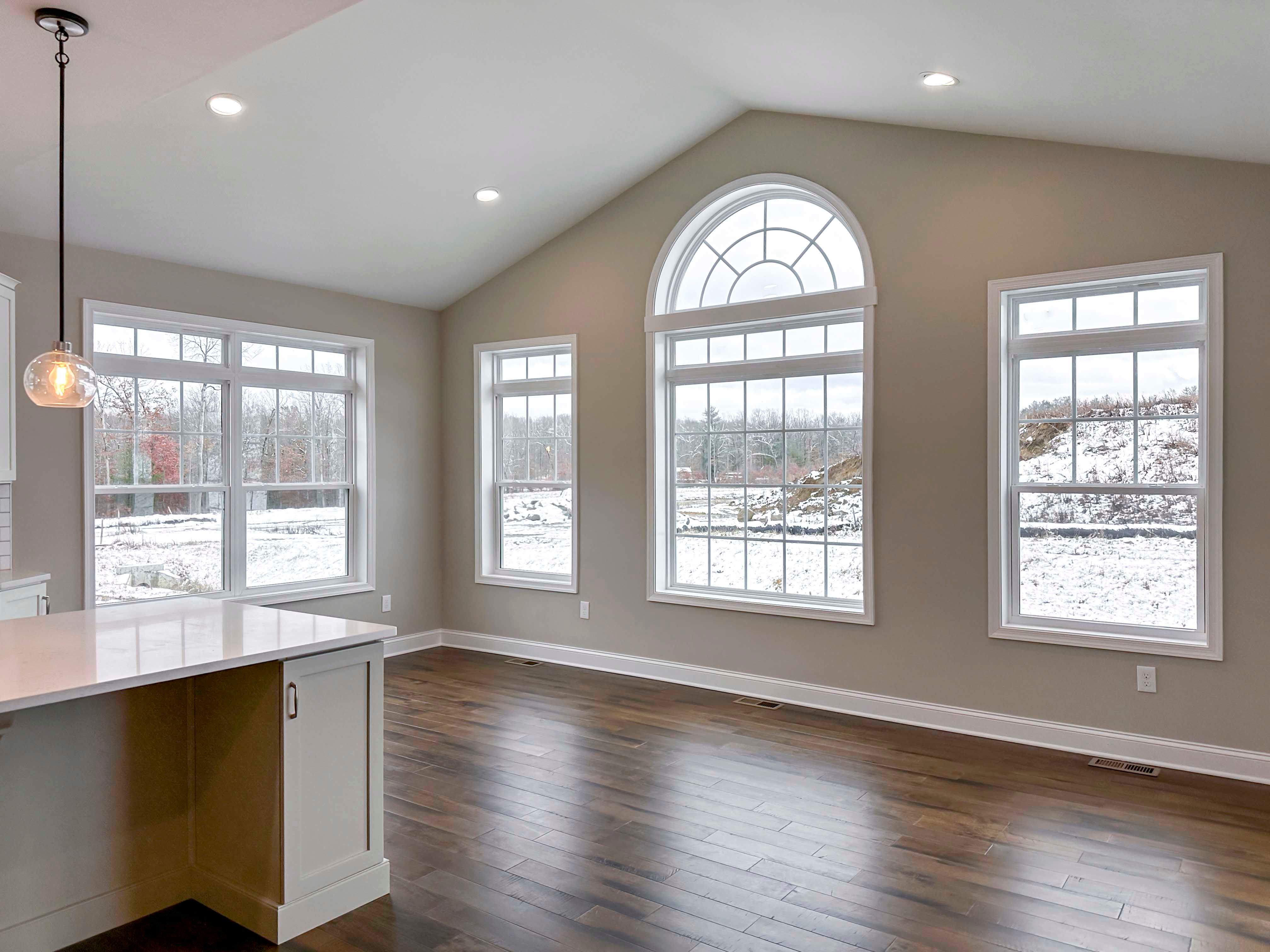 Optional Keeping Room with Cathedral Ceiling, arch-top window, and recessed lighting