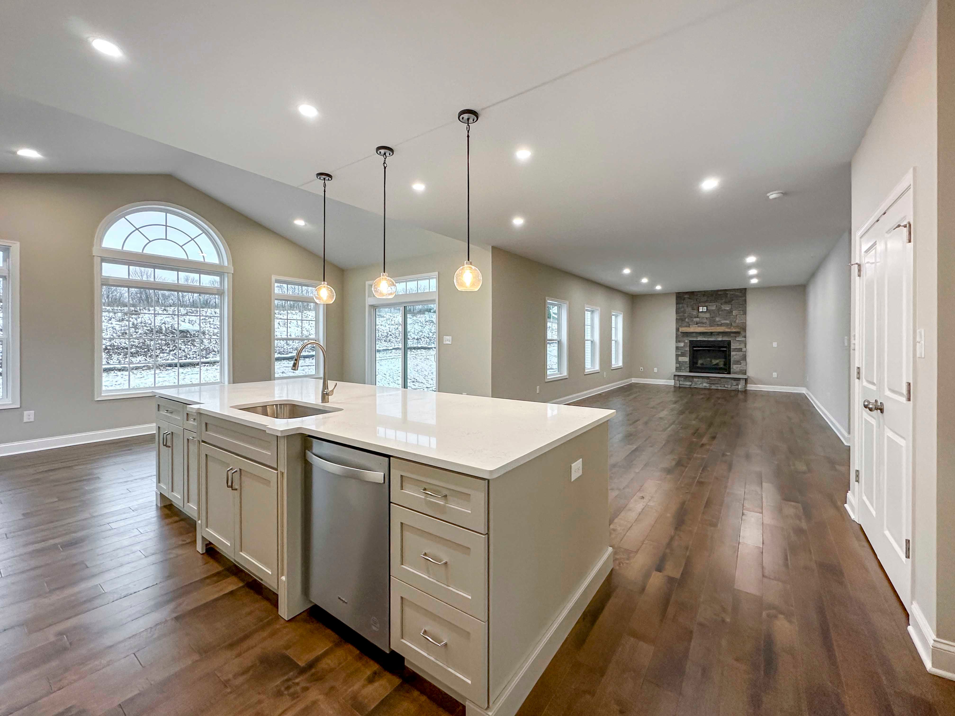 Kitchen with Island onlooking the Family Room with fireplace, Optional Keeping Room to left