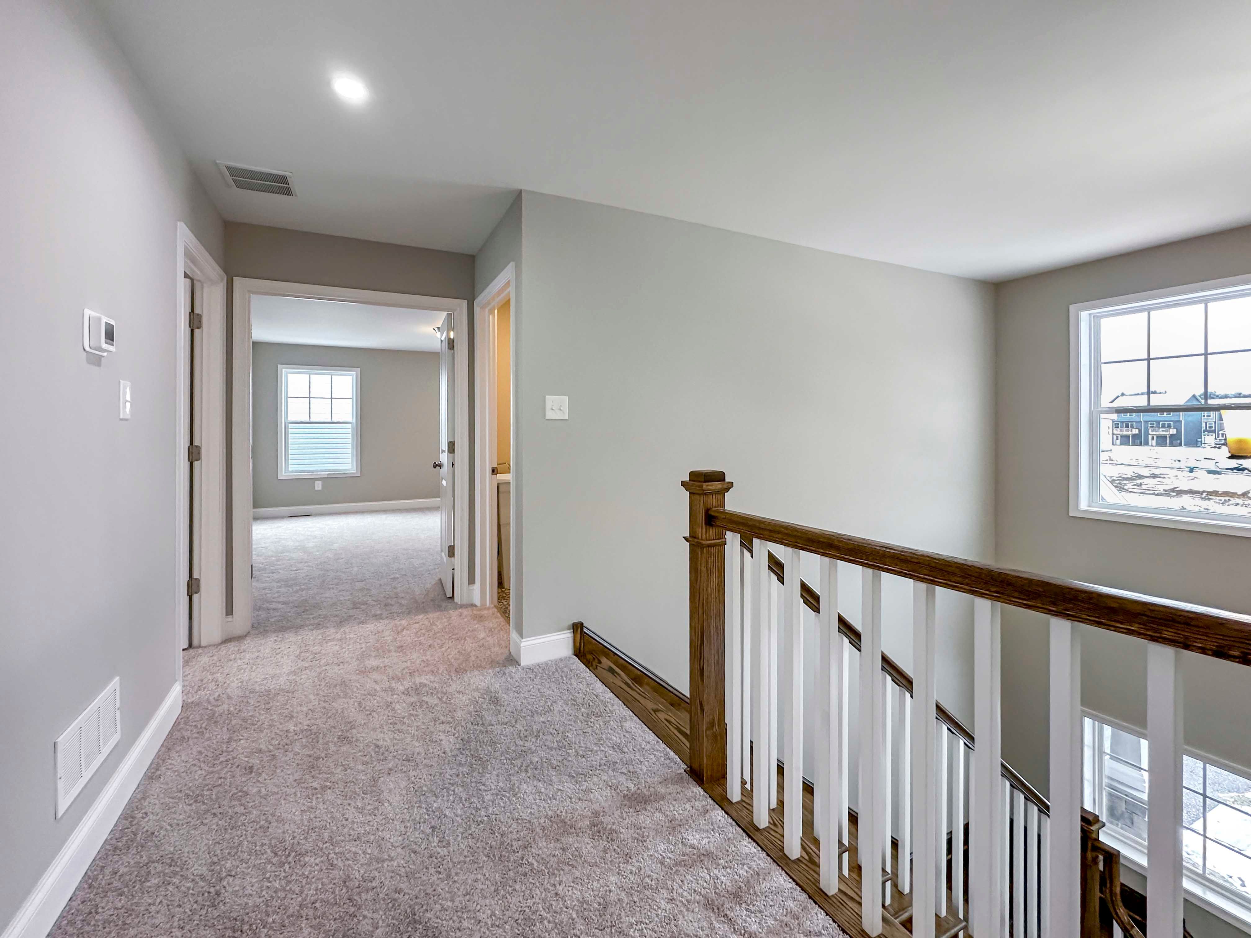 Landing of Second Floor - facing towards Owner's Bedroom entrance, Bedroom 4 entrance on left, Laundry Room entrance on right