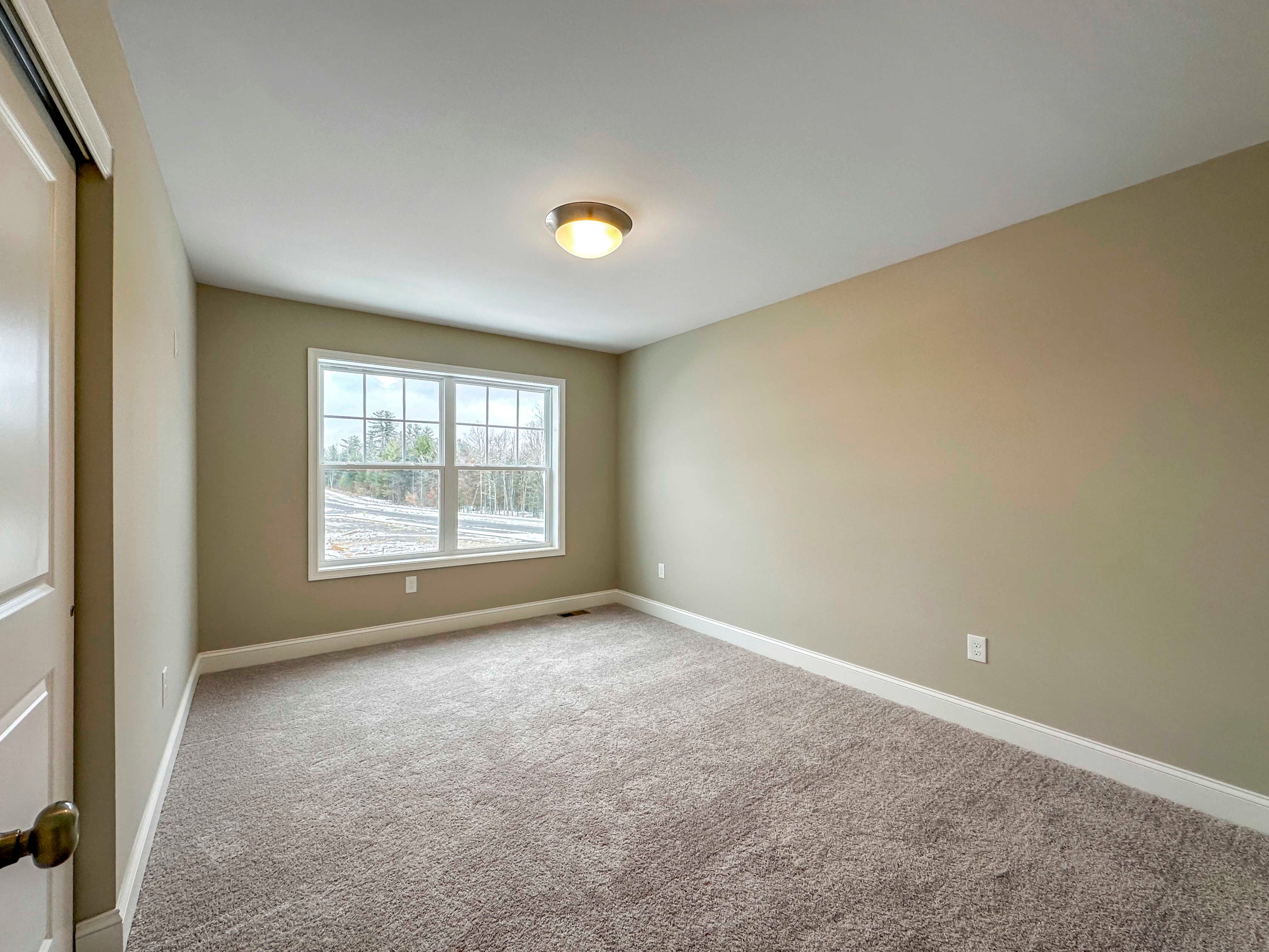 Bedroom 2 - Double pane window with plush carpeting