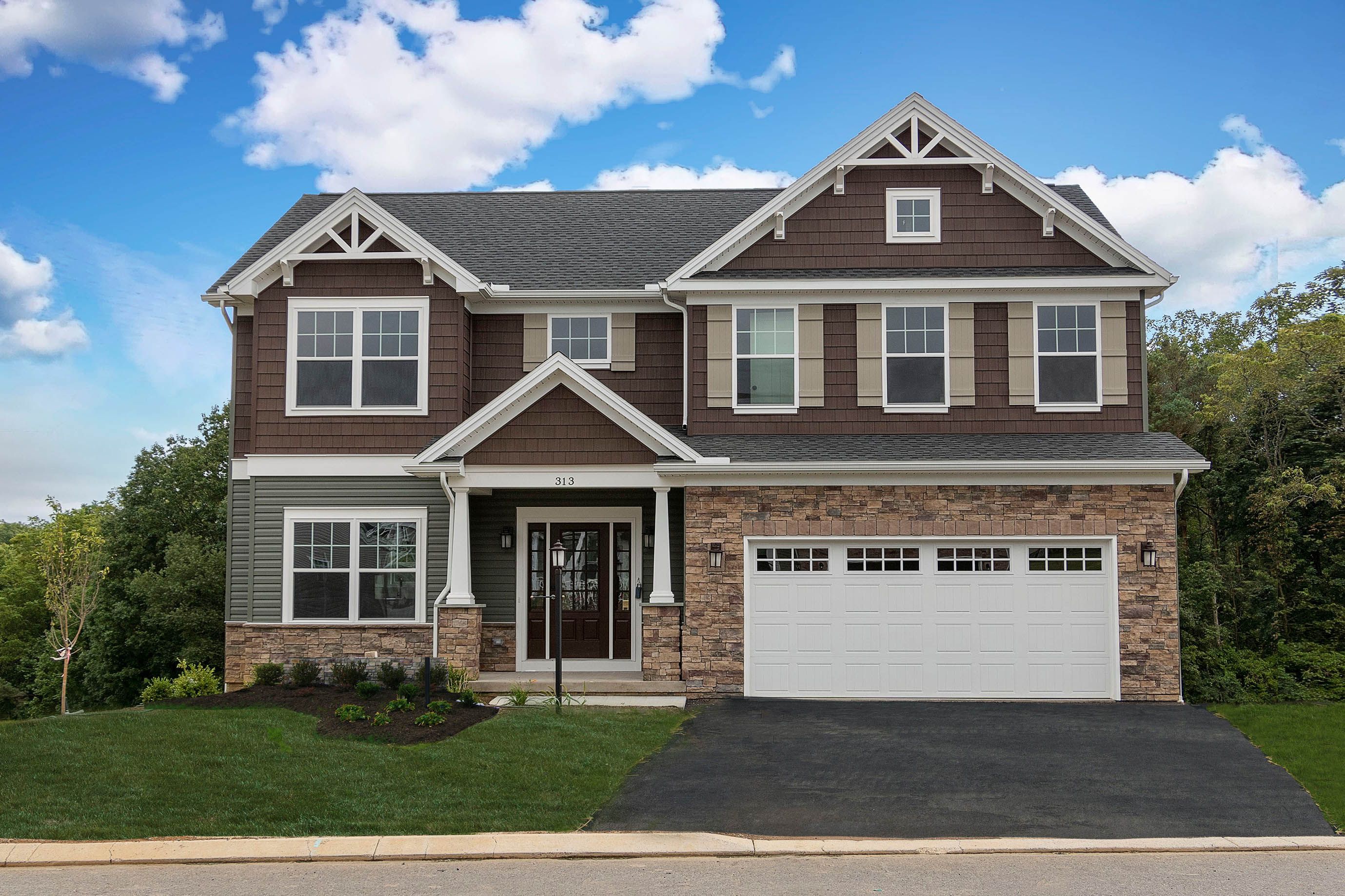 Dartmouth floorplan - two story Craftsman style home with partial stone, covered front entry, and two car front entry garage