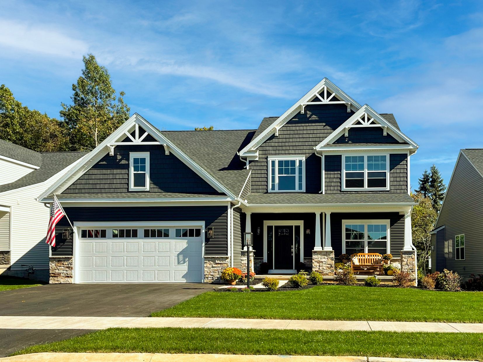 Dartmouth floorplan - two story Craftsman style home with partial stone, covered front entry, and two car front entry garage