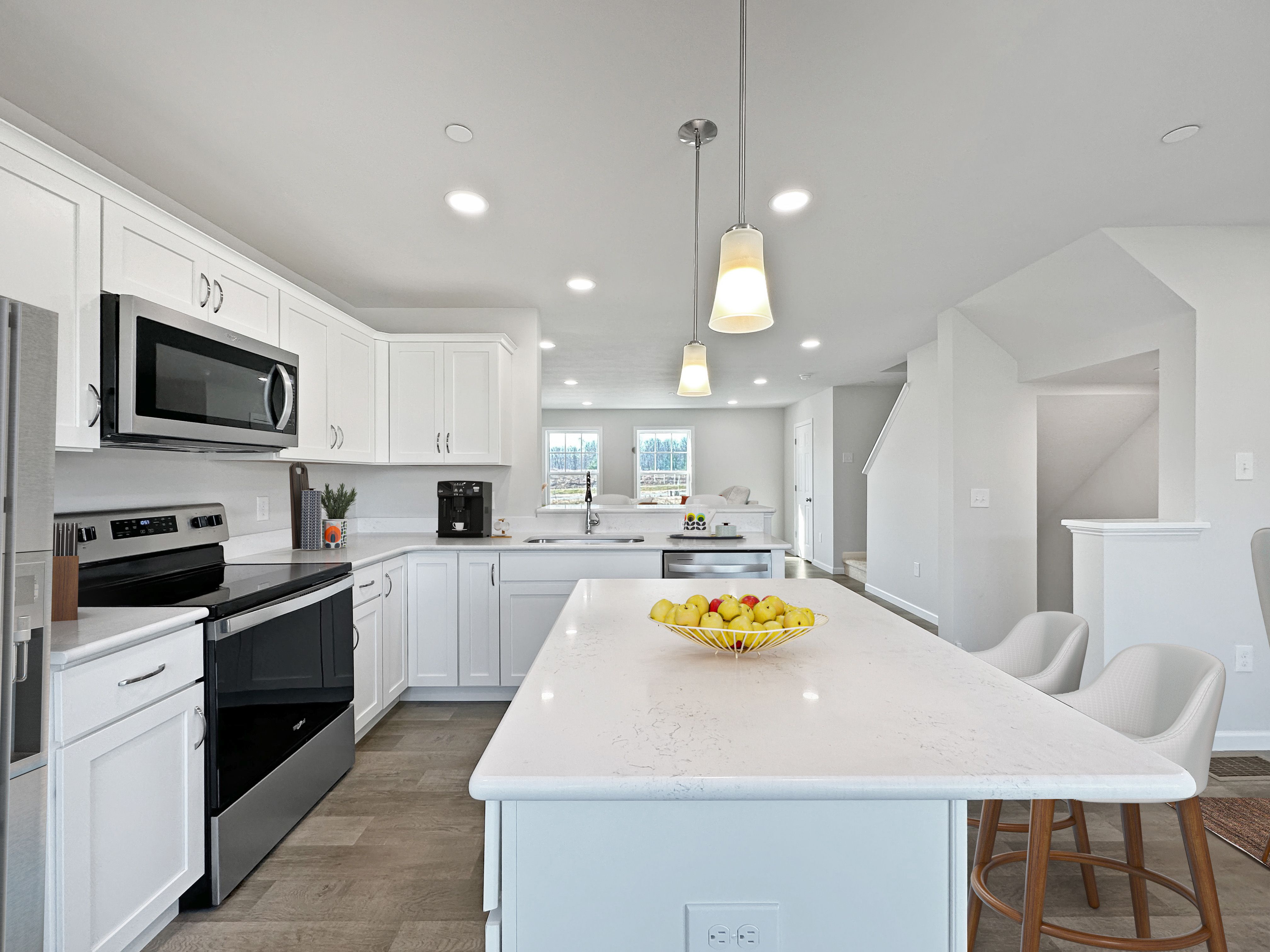 Elegant kitchen with central island and high-end finishes.