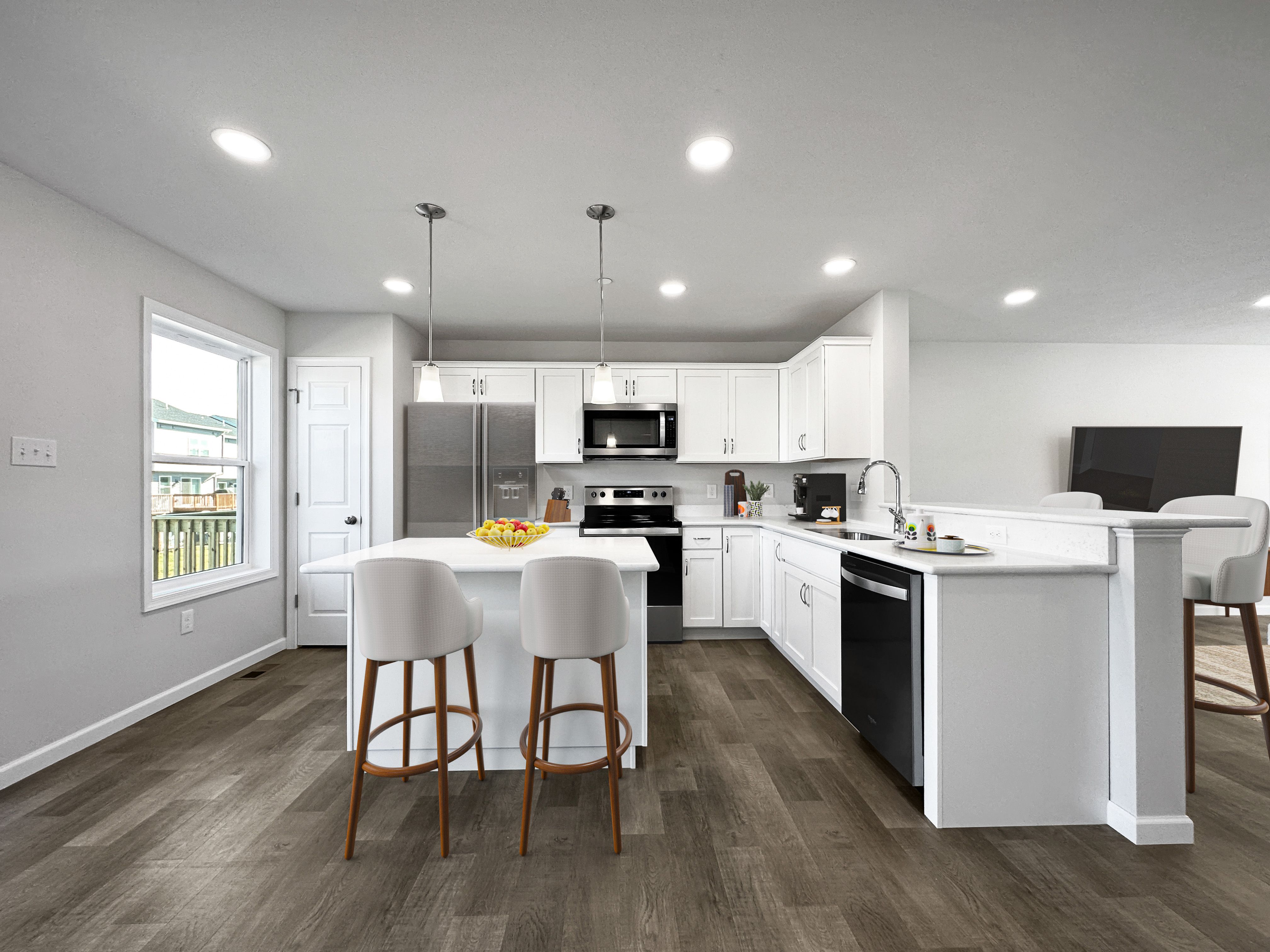 Bright kitchen space with modern amenities and dining nook.