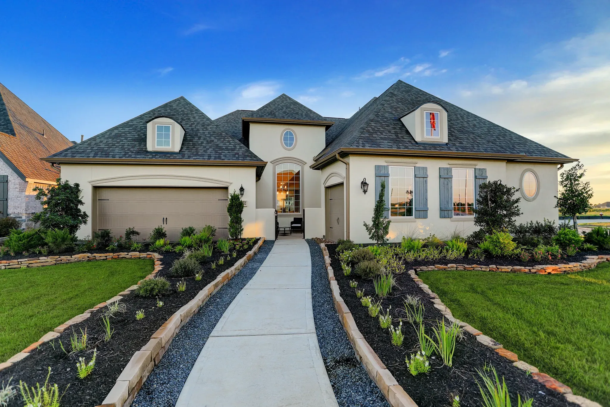 Plan 6015 exterior modeled at Del Bello Lakes