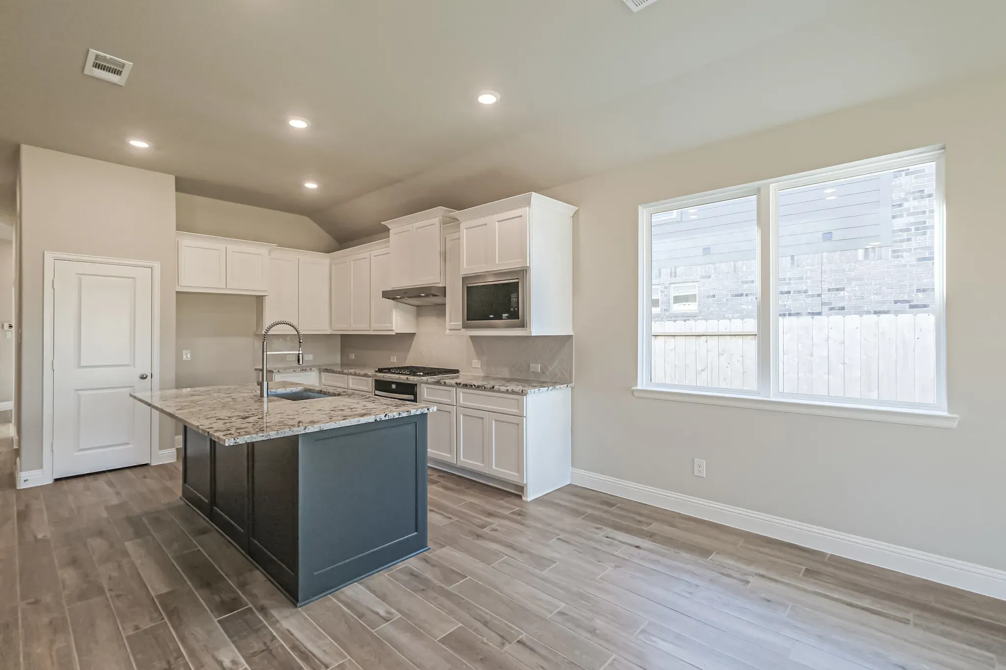 Plan 3029 kitchen-dining - look may vary