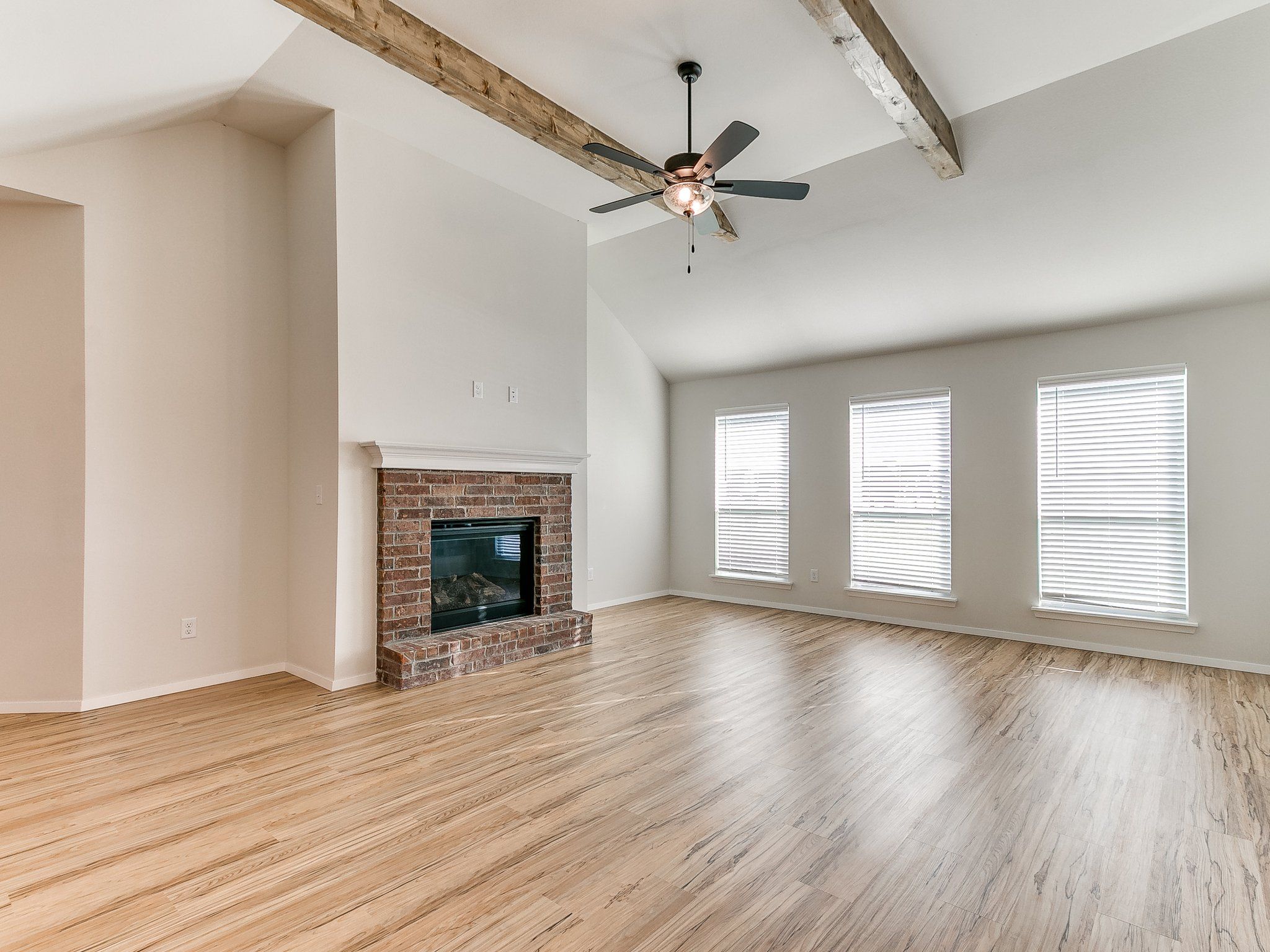 Cadence with a Fireplace and Wood Beams