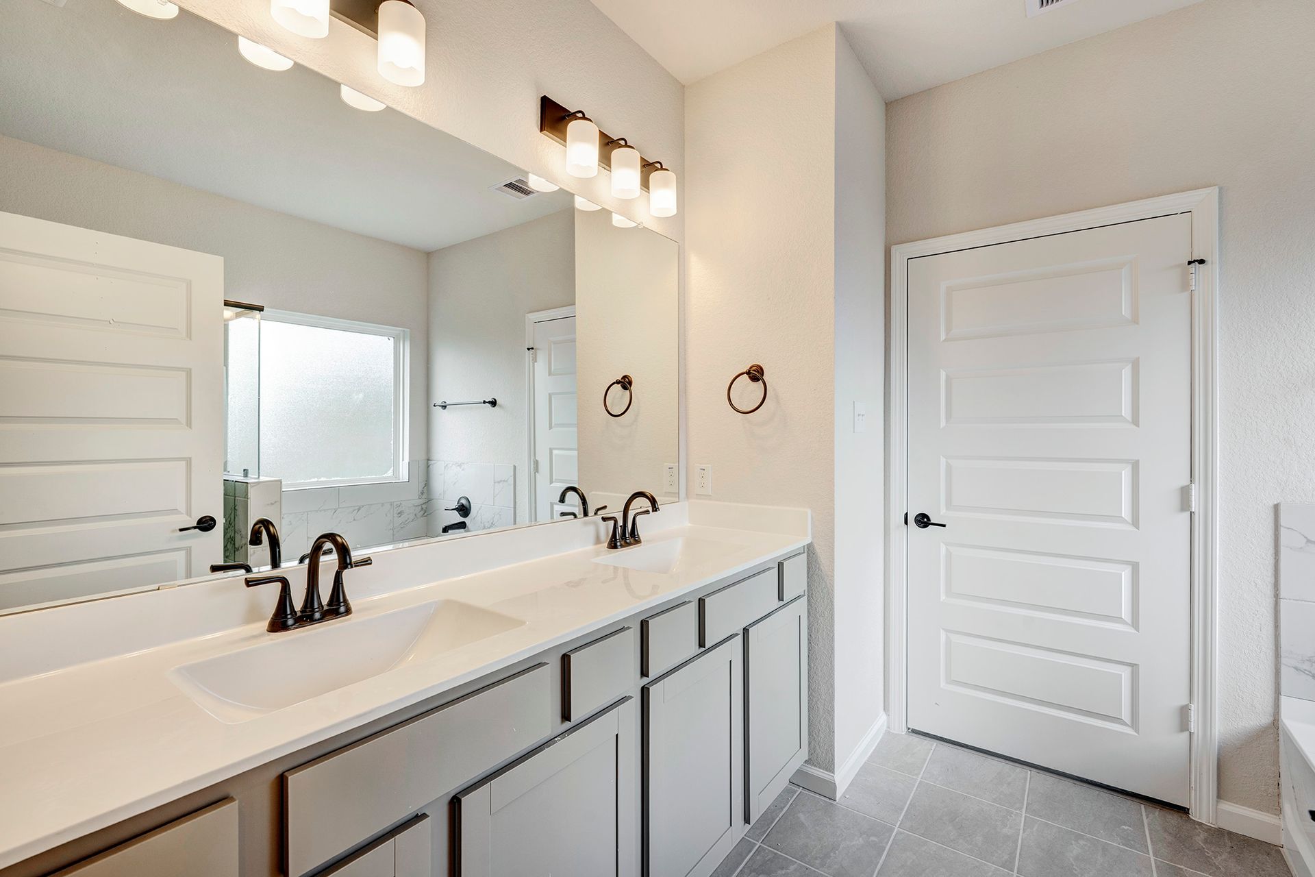 The Davenport II Primary Bathroom with Dual Vanities and Garden Tub