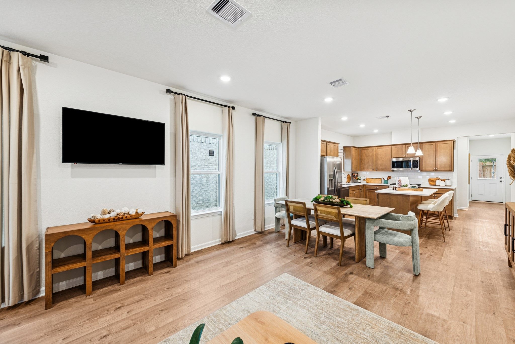 Family Room into Kitchen. Sample image for illustration; upgrades, options, and colors may vary.