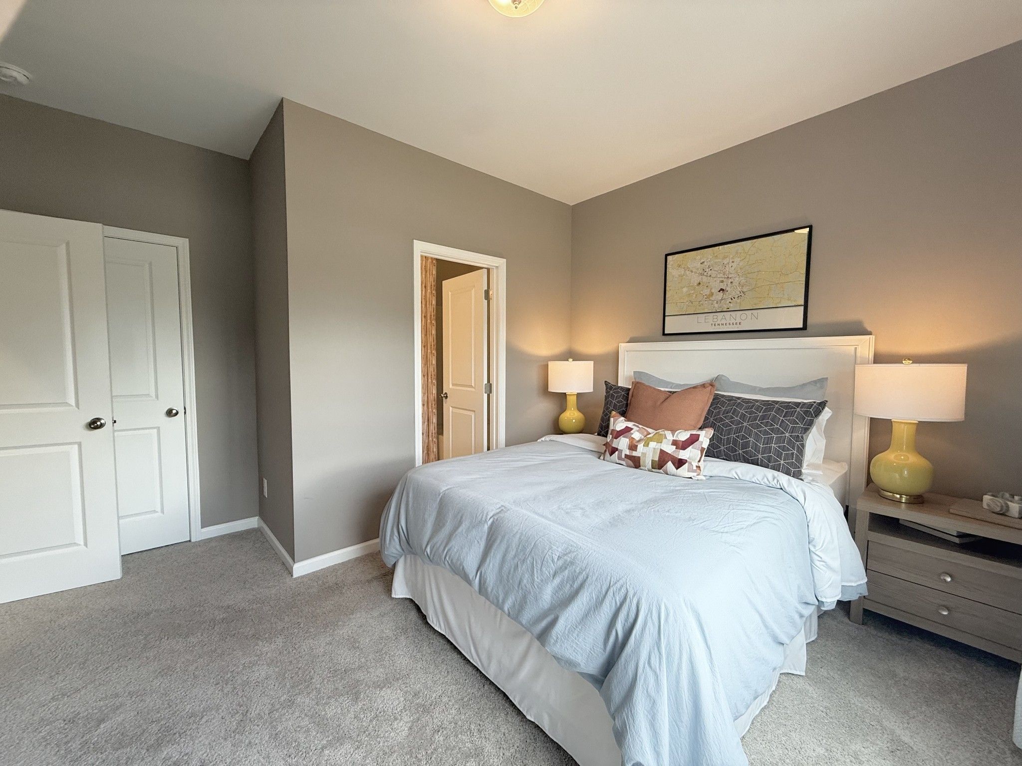 Bedroom 4 on main level with private en-suite. *Photos of model home*
