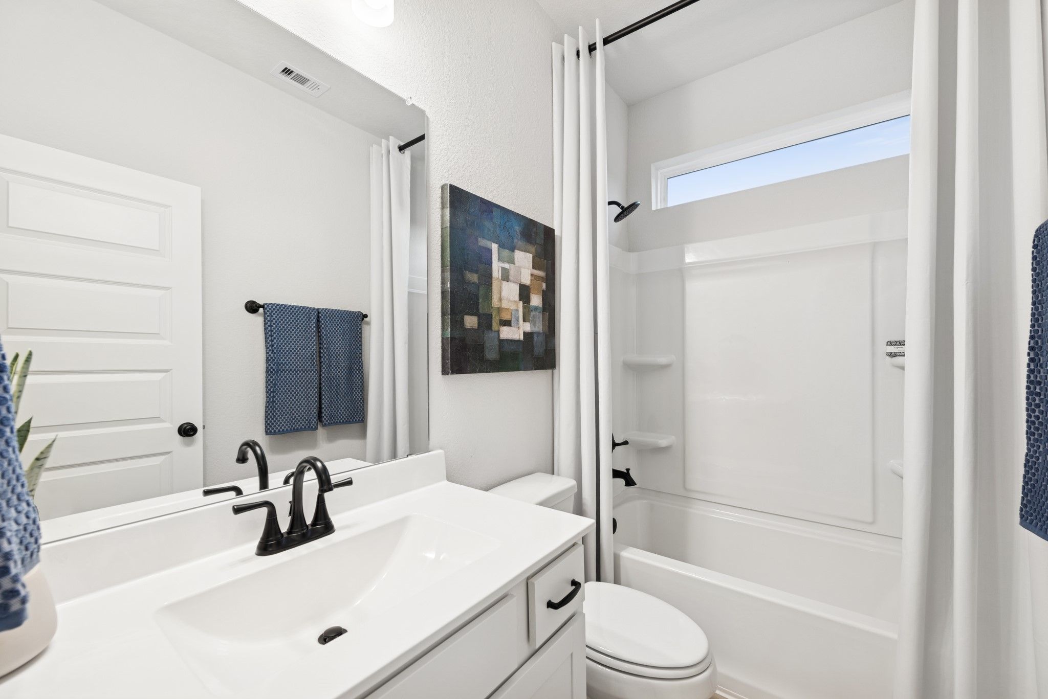 The Princeton II- Hall Bath 2. Staged model home shown for illustration only; actual features, colo